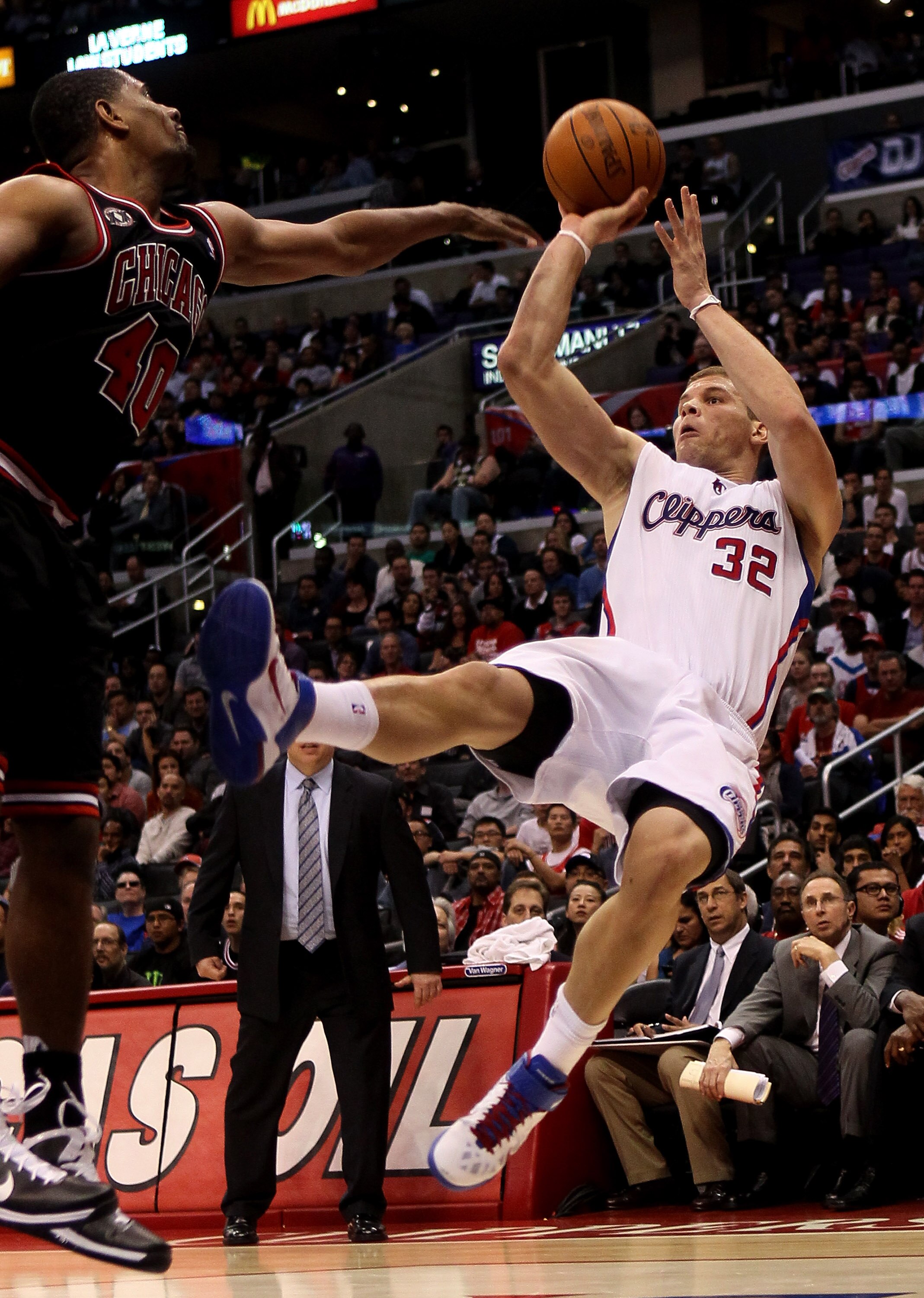LOS ANGELES, CA - FEBRUARY 2:   Blake Griffin #32 of the Los Angeles Clippers gets off a shot as he falls after being fouled by Kurt Thomas #40 of the Chicago Bulls at Staples Center on February 2, 2011  in Los Angeles, California. The Bulls won 106-88.