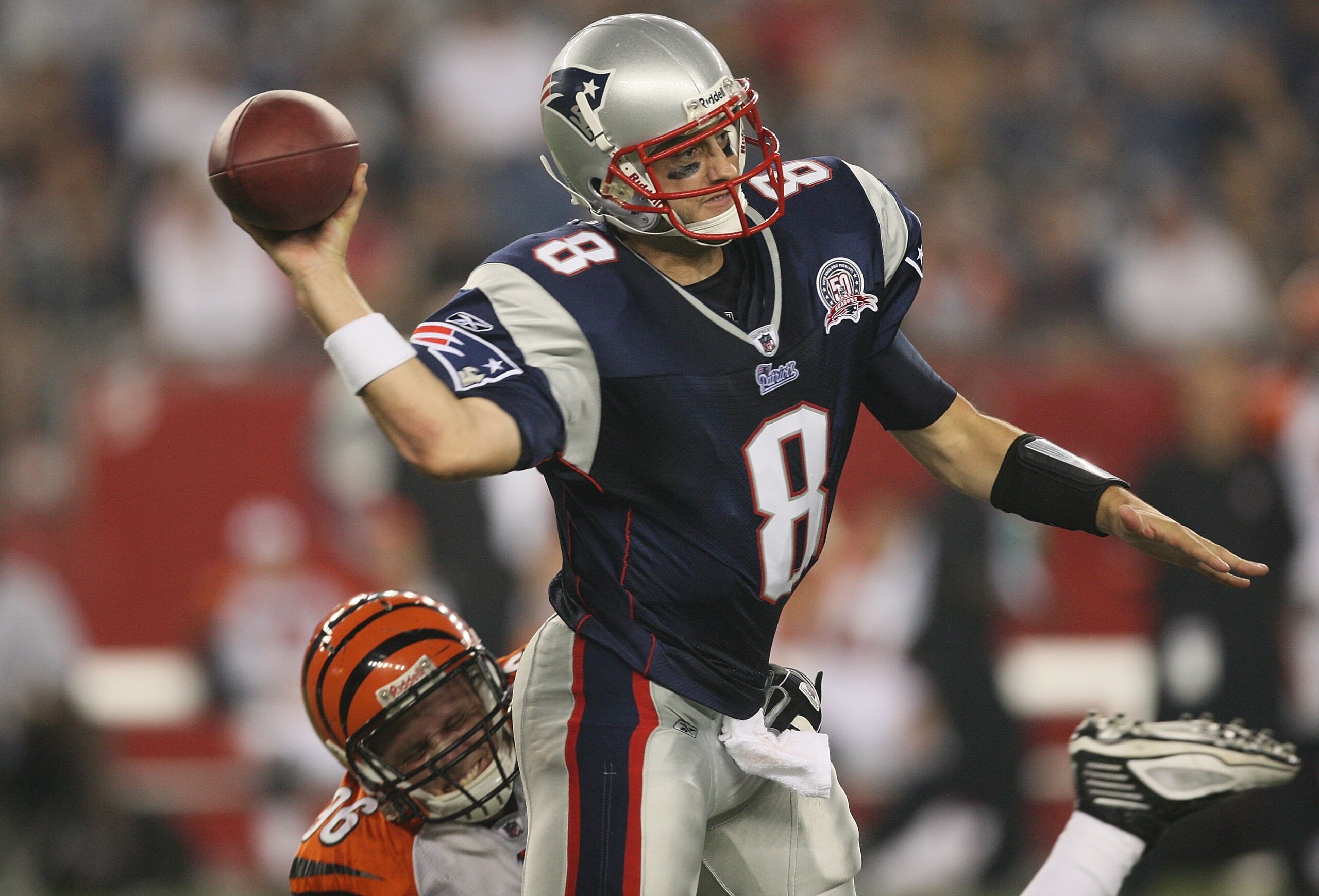 FOXBORO, MA - AUGUST 20:  Brian Hoyer #8 of the New England Patriots feels the pressure of Chris Pressley #36 of the Cincinnati Bengals at Gillette Stadium on August 20, 2009 in Foxboro, Massachusetts. (Photo by Jim Rogash/Getty Images)
