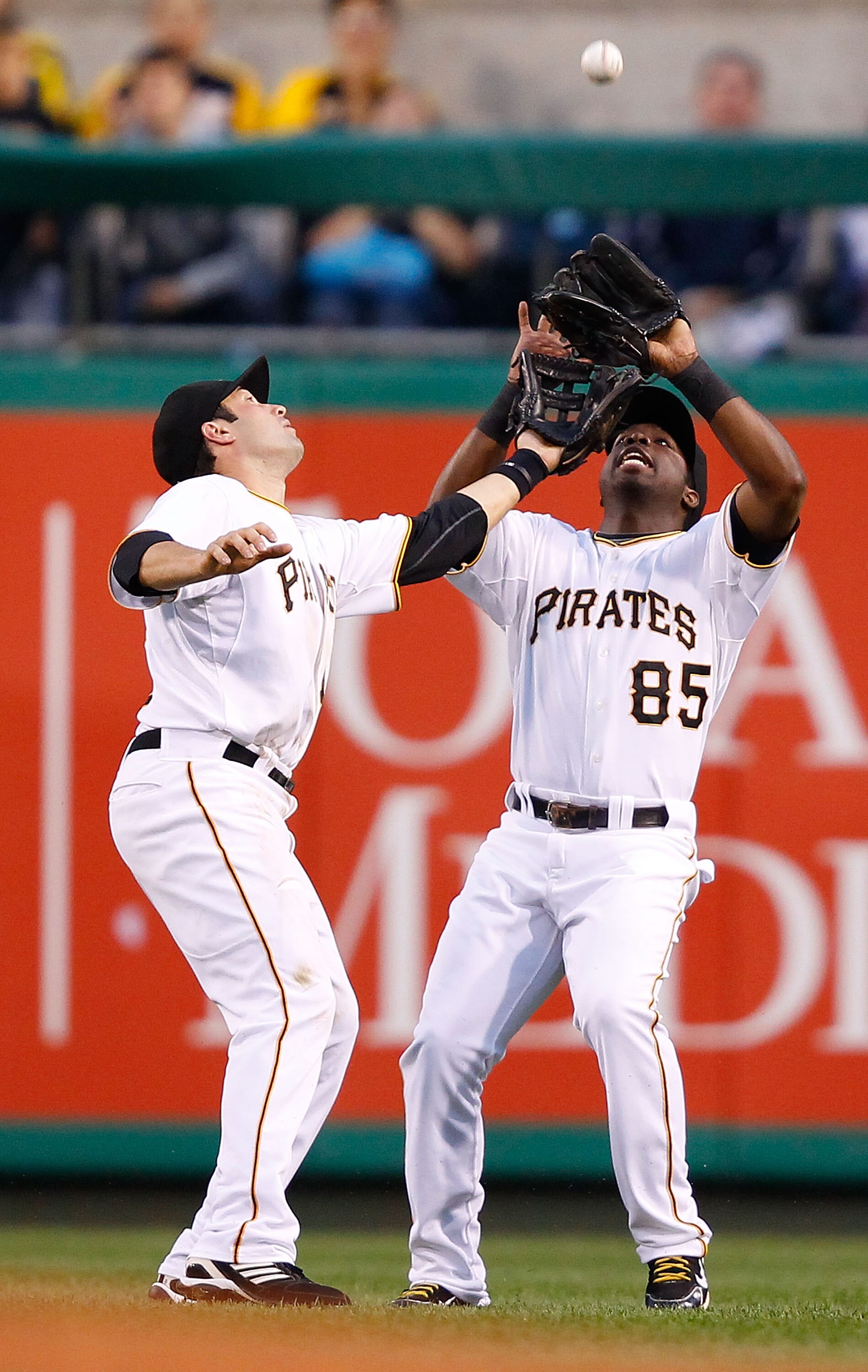 PITTSBURGH - AUGUST 23:  Neil Walker #18 and Lastings Milledge #85 of the Pittsburgh Pirates both attempt to make a catch on a fly ball during the game against the St Louis Cardinals on August 23, 2010 at PNC Park in Pittsburgh, Pennsylvania.  (Photo by J