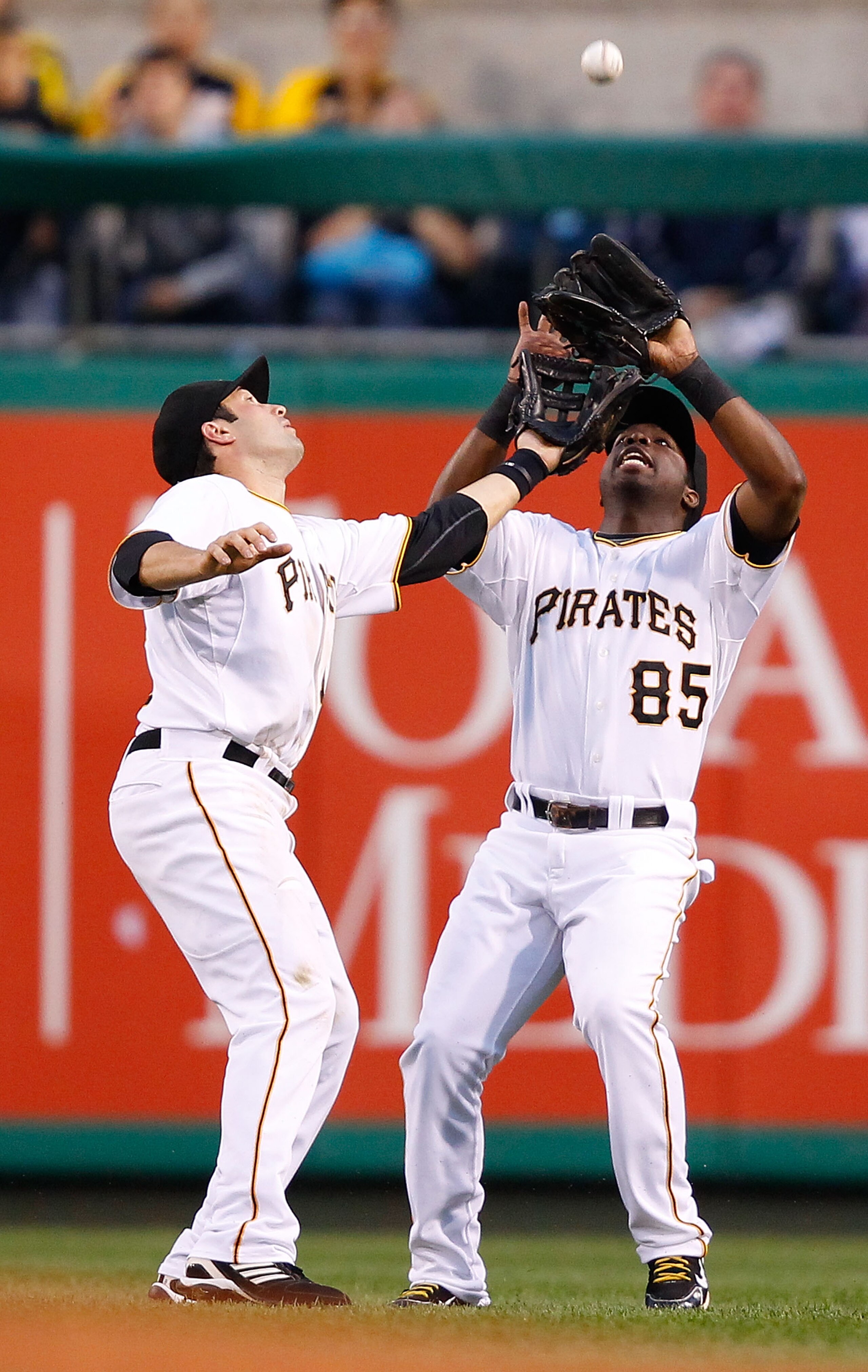 PITTSBURGH - AUGUST 23:  Neil Walker #18 and Lastings Milledge #85 of the Pittsburgh Pirates both attempt to make a catch on a fly ball during the game against the St Louis Cardinals on August 23, 2010 at PNC Park in Pittsburgh, Pennsylvania.  (Photo by J