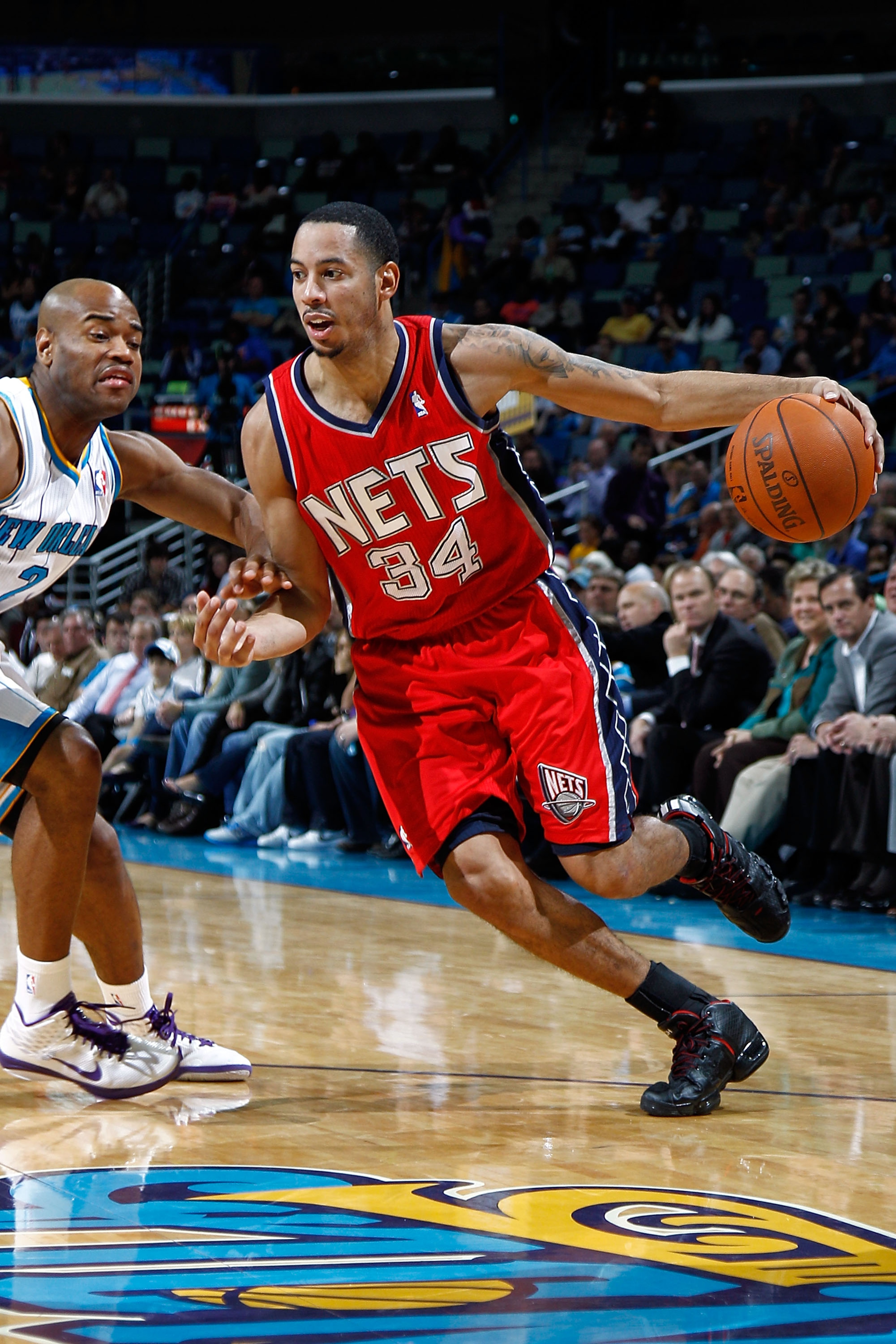 NEW ORLEANS, LA - DECEMBER 22: Devin Harris #34 of the New Jersey Nets drives the ball around Jarrett Jack #2 of the New Orleans Hornets at the New Orleans Arena on December 22, 2010 in New Orleans, Louisiana. The Hornets defeated the Nets 105-91. NEW ORLEANS, LA - DECEMBER 22: Devin Harris #34 of the New Jersey Nets drives the ball around Jarrett Jack #2 of the New Orleans Hornets at the New Orleans Arena on December 22, 2010 in New Orleans, Louisiana. The Hornets defeated the Nets 105-91.