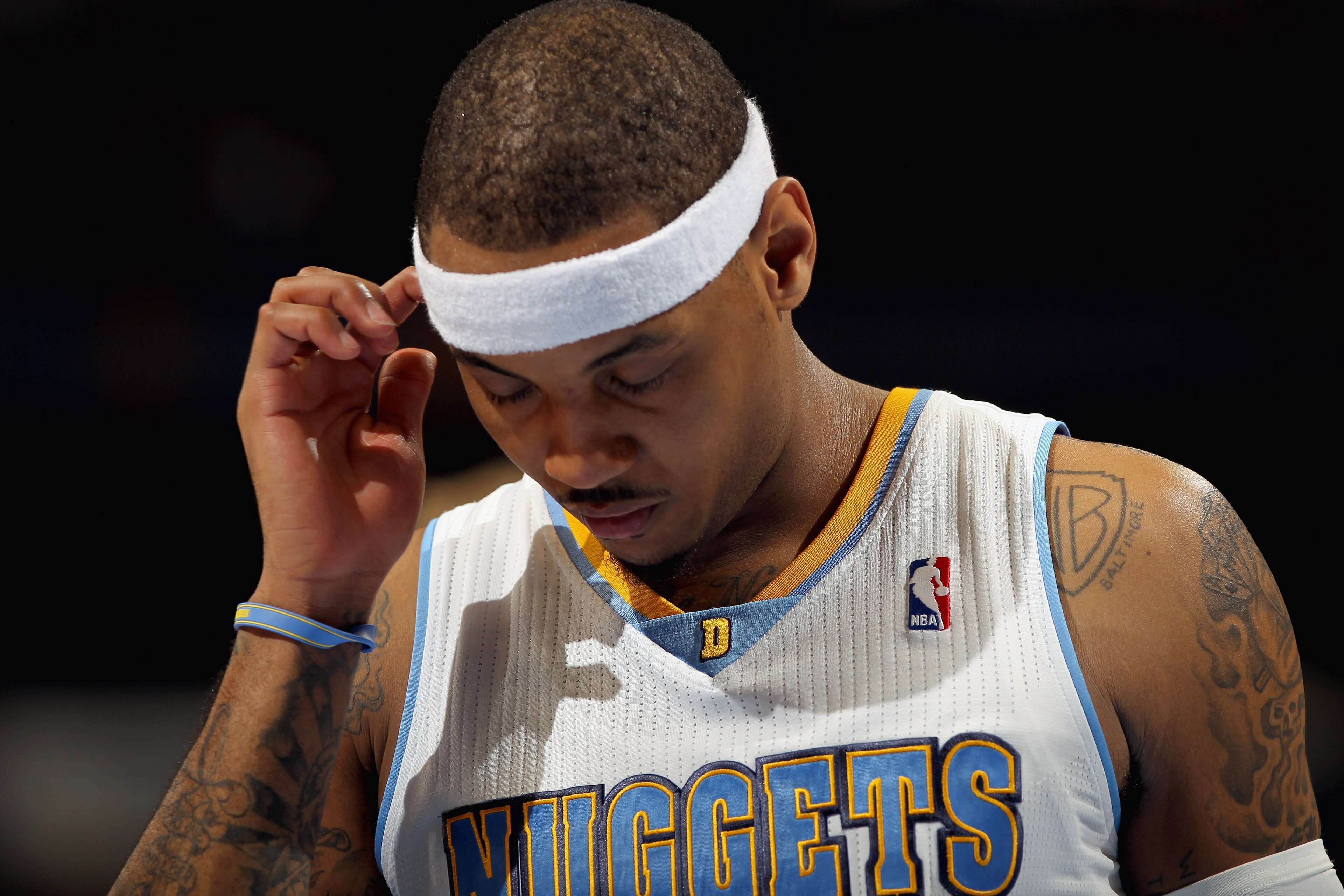 DENVER, CO - FEBRUARY 10: Carmelo Anthony #15 of the Denver Nuggets looks on during a break in the action against the Dallas Mavericks during NBA action at the Pepsi Center on February 10, 2011 in Denver, Colorado. The Nuggets defeated the Mavericks 121- DENVER, CO - FEBRUARY 10: Carmelo Anthony #15 of the Denver Nuggets looks on during a break in the action against the Dallas Mavericks during NBA action at the Pepsi Center on February 10, 2011 in Denver, Colorado. The Nuggets defeated the Mavericks 121-