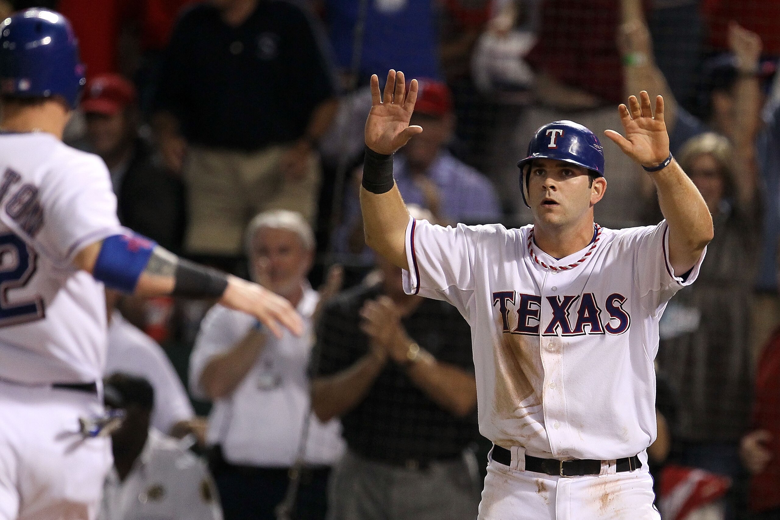 ARLINGTON, TX - OCTOBER 22:  Mitch Moreland #18 of the Texas Rangers scores ahead of Josh Hamilton #32 in the bottom of the fifth inning against the New York Yankees in Game Six of the ALCS during the 2010 MLB Playoffs at Rangers Ballpark in Arlington on