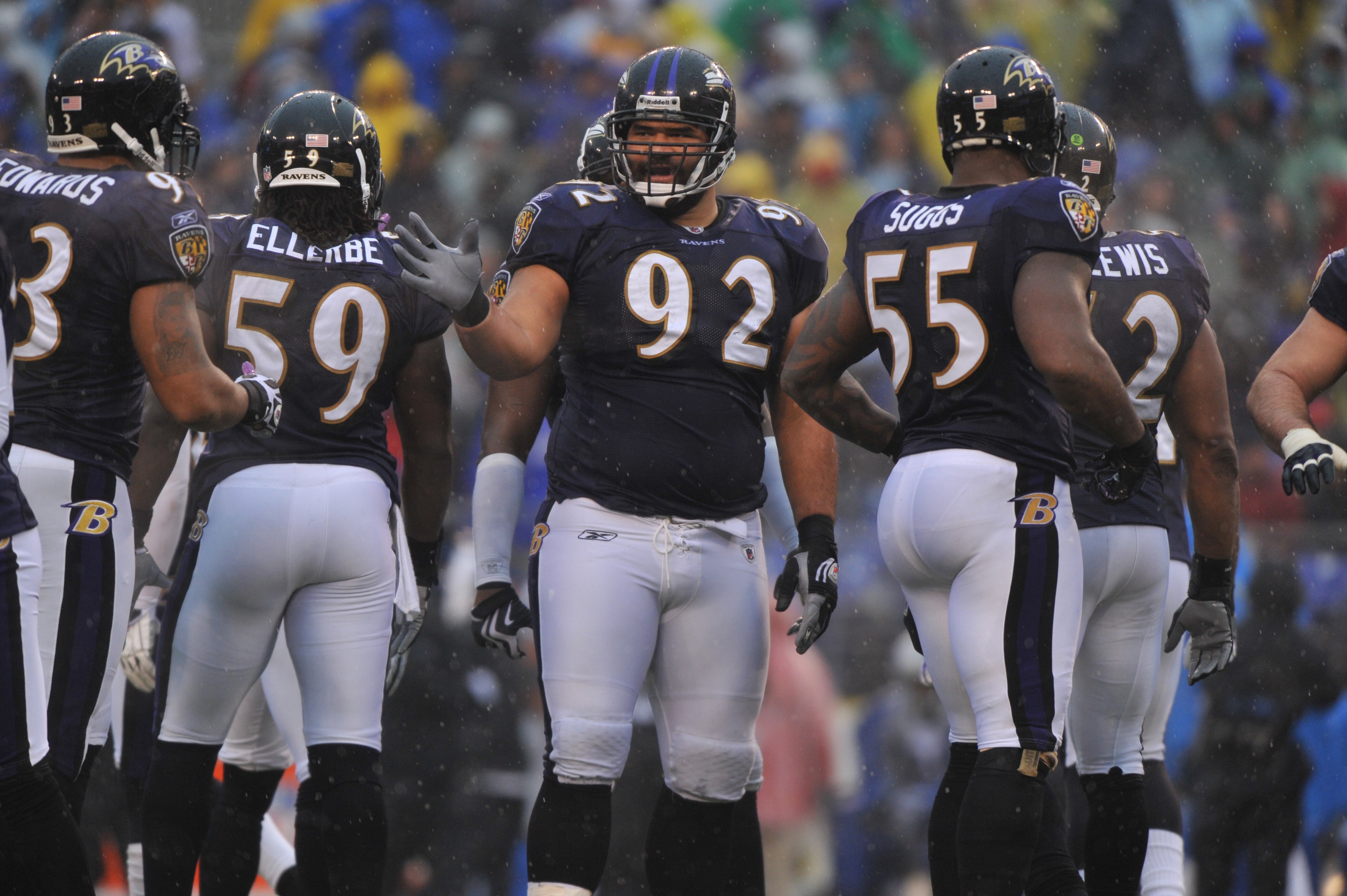 BALTIMORE - DECEMBER 13:  Haloti Ngata #92 of the Baltimore Ravens huddles with his teammates during the game against the Detroit Lions at M&T Bank Stadium on December 13, 2009 in Baltimore, Maryland. The Ravens defeated the Lions 48-3. (Photo by Larry Fr