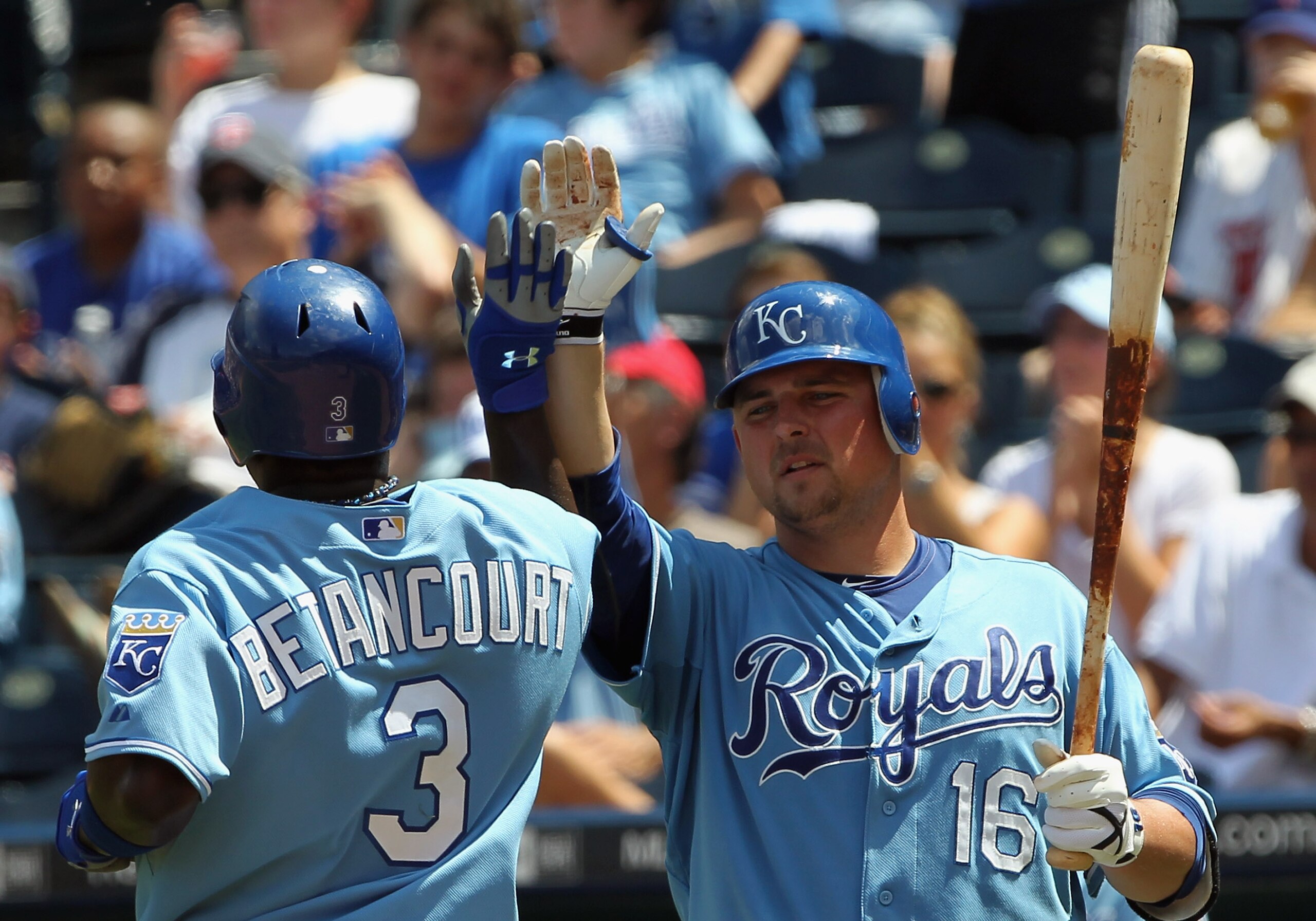 KANSAS CITY, MO - JULY 28:  Billy Butler #16 of the Kansas City Royals congratulates Yuniesky Betancourt #3 after a run during the game against  the Minnesota Twins on July 28, 2010 at Kauffman Stadium in Kansas City, Missouri.  (Photo by Jamie Squire/Get