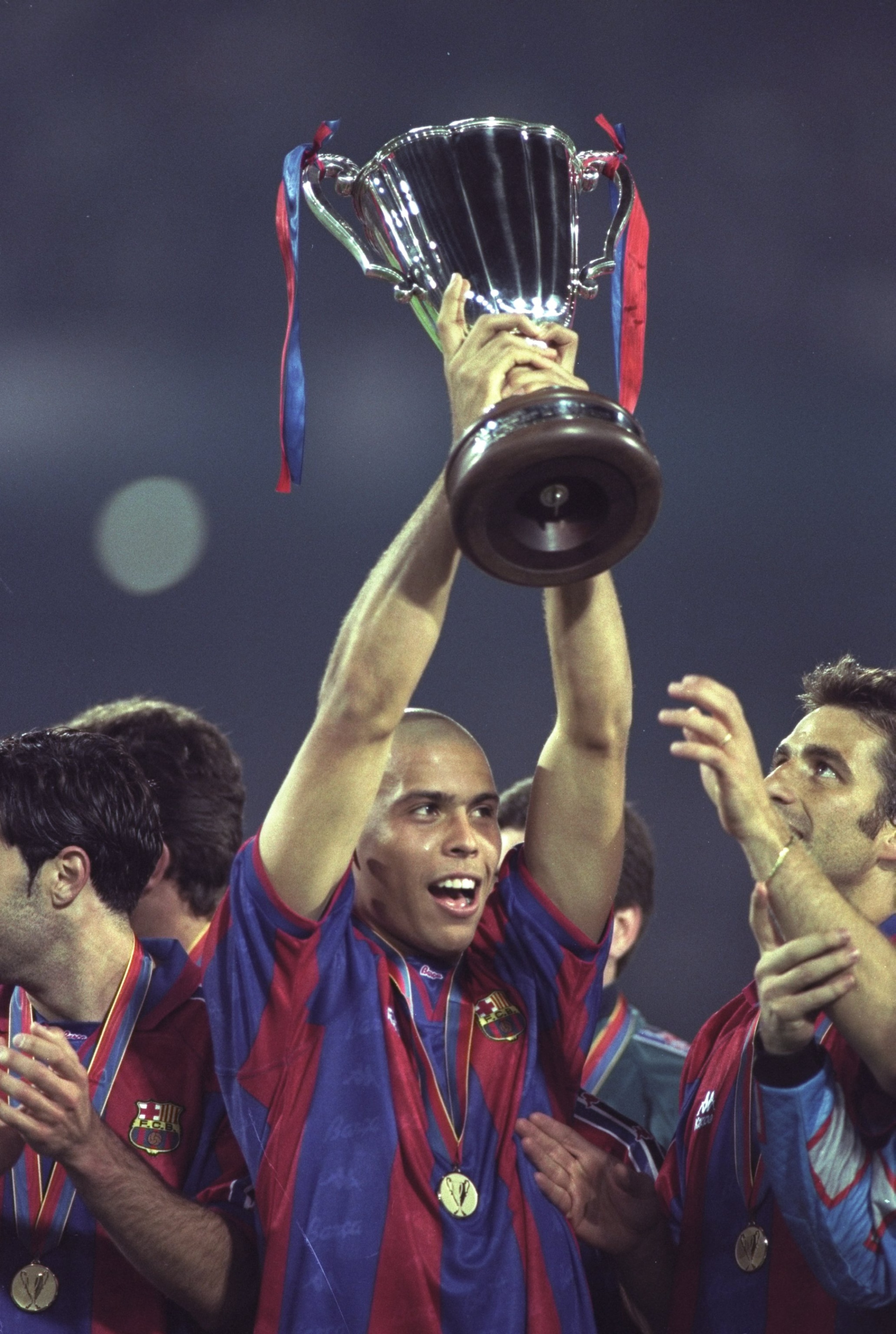 14 May 1997: Ronaldo of Barcelona holds aloft the European Cup Winners Cup after victory against Paris St Germain in Rotterdam, Holland. Barcelona won 1-0. \ Mandatory Credit: Stu Forster /Allsport 14 May 1997: Ronaldo of Barcelona holds aloft the European Cup Winners Cup after victory against Paris St Germain in Rotterdam, Holland. Barcelona won 1-0. \ Mandatory Credit: Stu Forster /Allsport