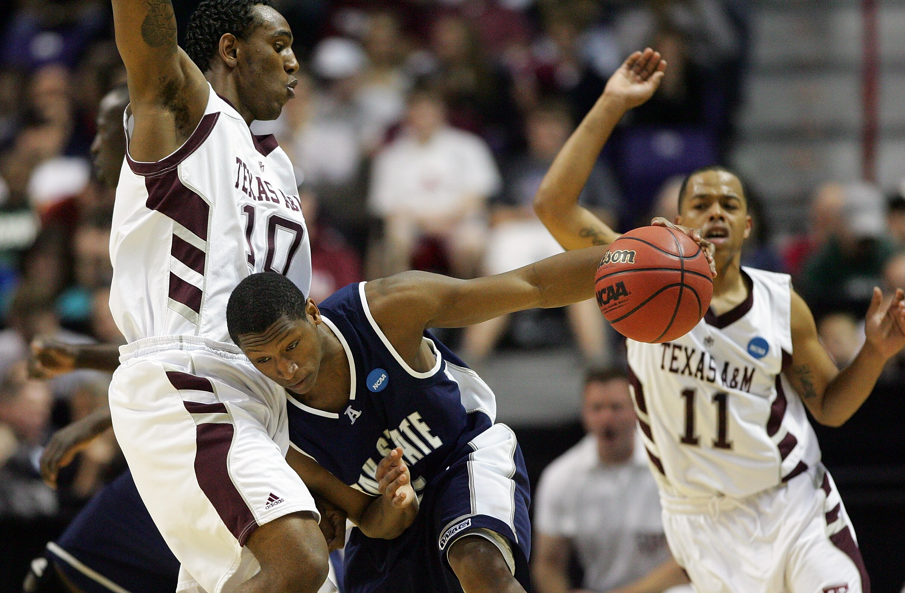 SPOKANE, WA - MARCH 19:  Pooh Williams #5 of the Utah St. Aggies drives against David Loubeau #10 of the Texas A&M Aggies during the first round of the 2010 NCAA men's basketball tournament at Spokane Arena on March 19, 2010 in Spokane, Washington.  (Phot