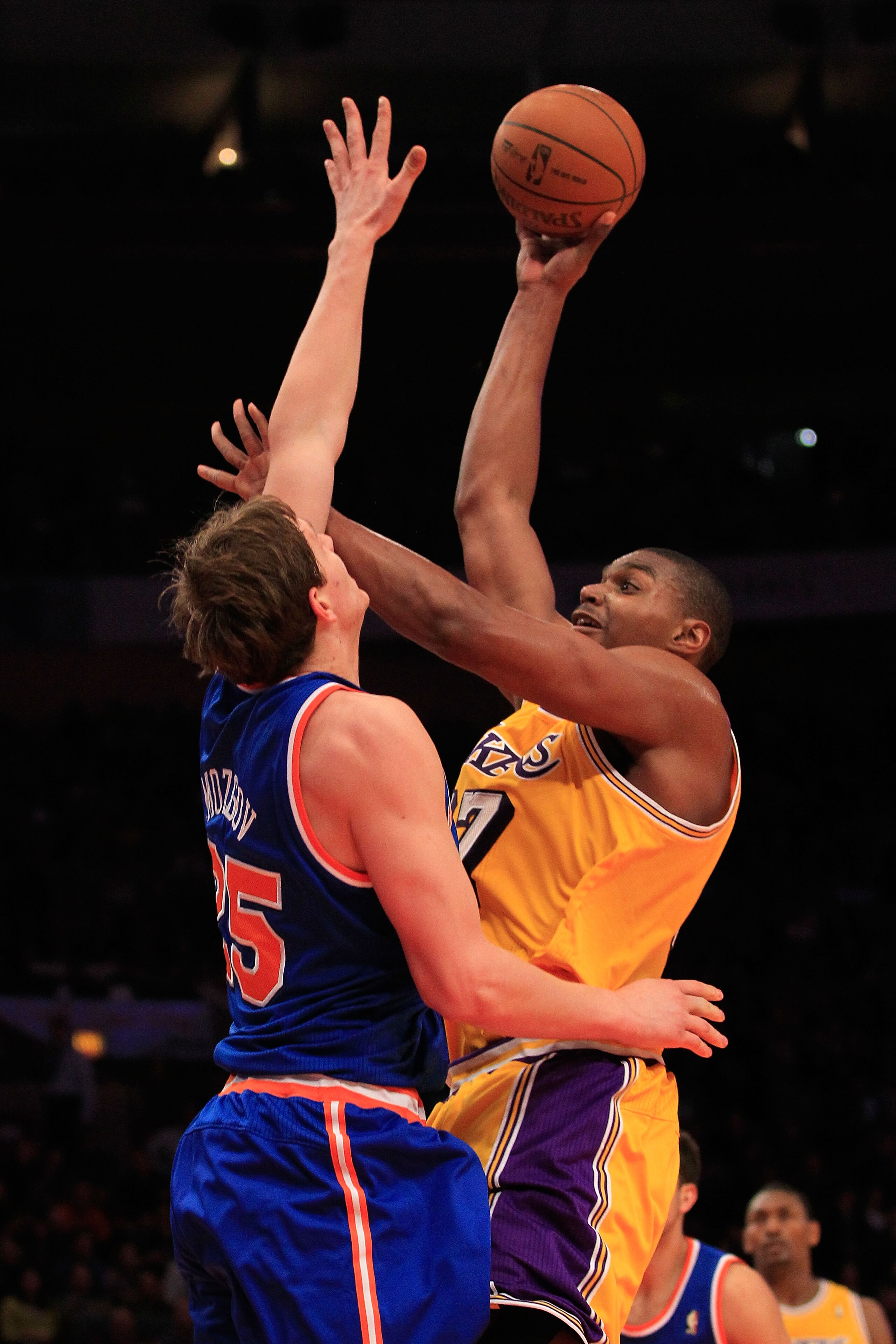 NEW YORK, NY - FEBRUARY 11: Andrew Bynum #17 of the Los Angeles Lakers shoots over Timofey Mozgov #25 of the New York Knicks at Madison Square Garden on February 11, 2011 in New York City. NOTE TO USER: User expressly acknowledges and agrees that, by down