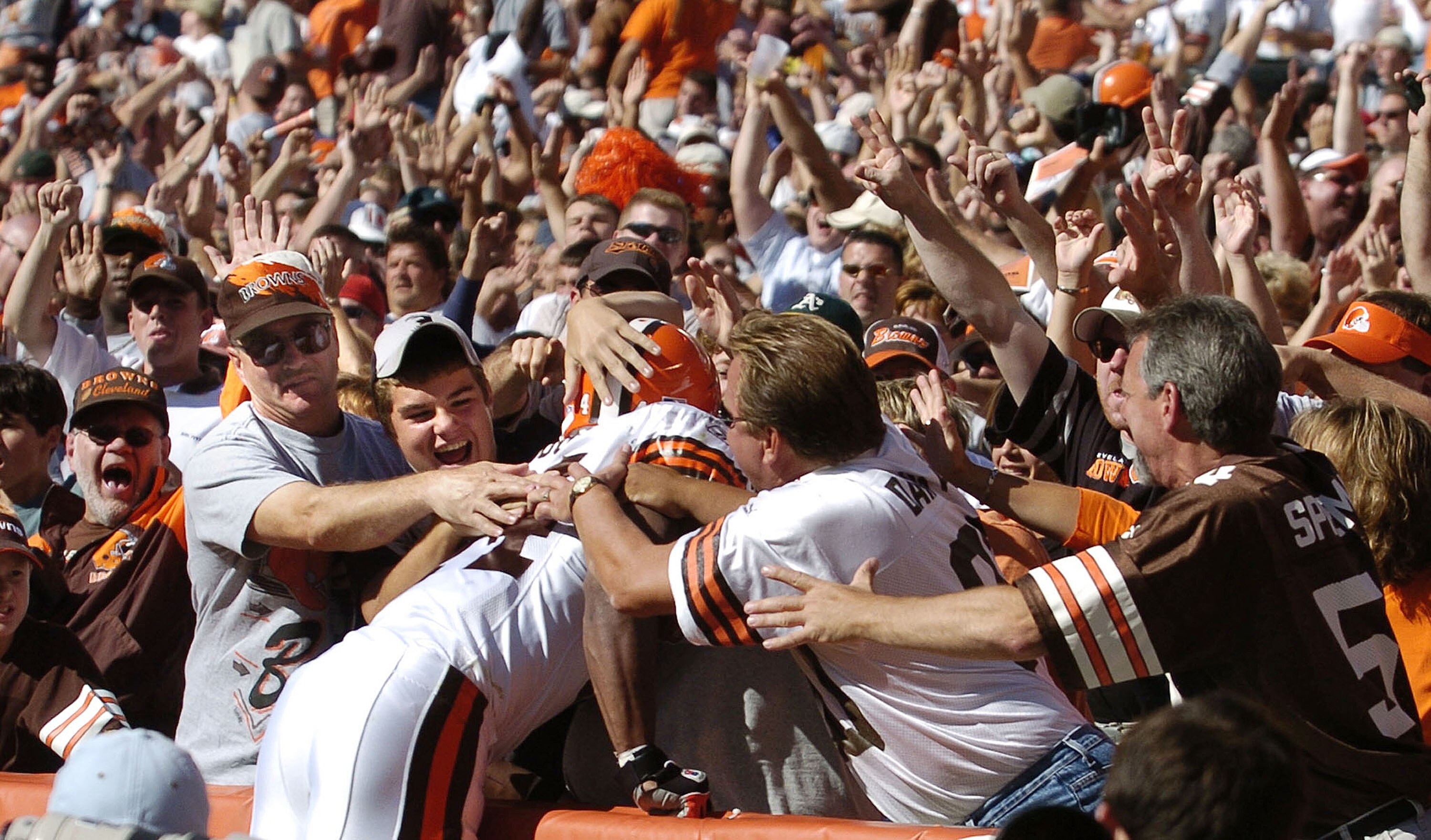 CLEVELAND - AUGUST 21:  Running back Lee Suggs #44 of the Cleveland Browns is welcomed into the Dawg Pound after scoring a touchdown during the second quarter of the pre-season game between the Cleveland Browns and the Detroit Lions on August 21, 2004 at