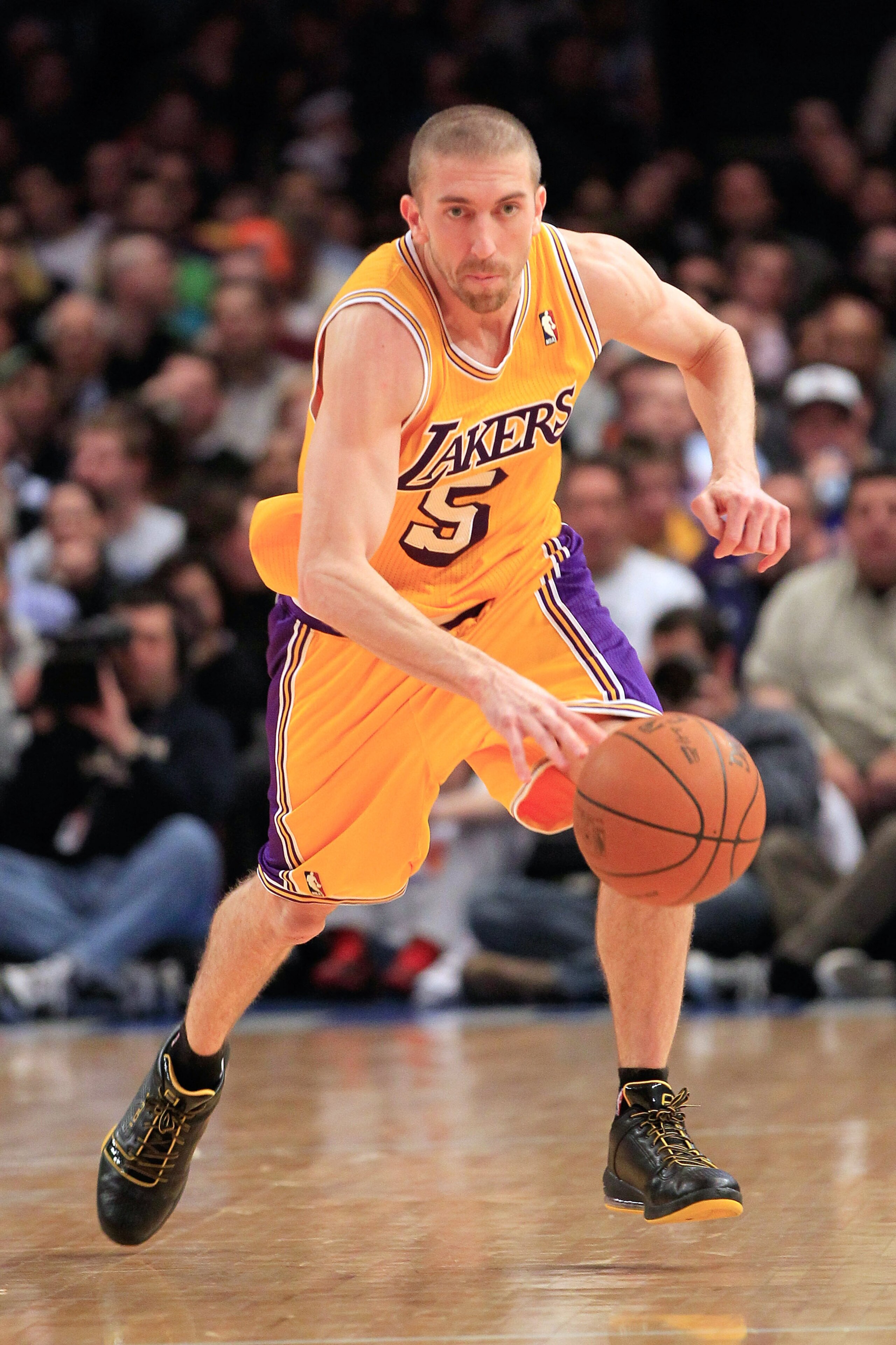 NEW YORK, NY - FEBRUARY 11: Steve Blake #5 of the Los Angeles Lakers dribbles the ball against the New York Knicks at Madison Square Garden on February 11, 2011 in New York City. NOTE TO USER: User expressly acknowledges and agrees that, by downloading an