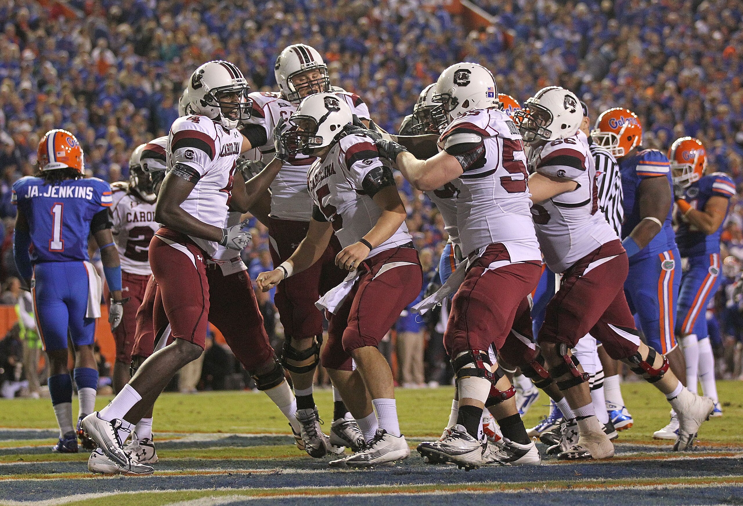 GAINESVILLE, FL - NOVEMBER 13:  Stephen Garcia #5 of the South Carolina Gamecocks is congratulated by teammates after rushing for a touchdown during a game against the Florida Gators at Ben Hill Griffin Stadium on November 13, 2010 in Gainesville, Florida