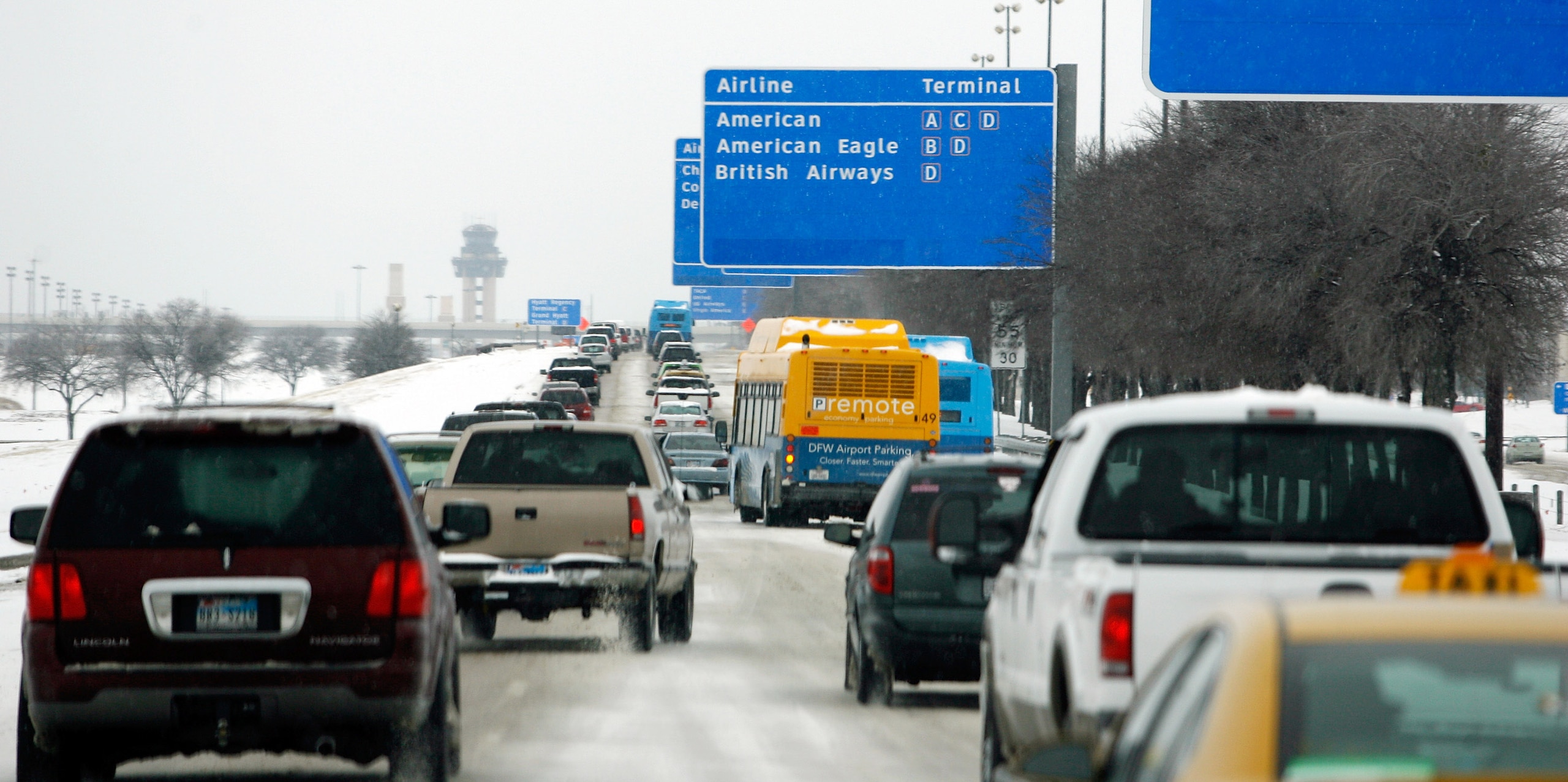 SOUTH LAKE, TX - FEBRUARY 04:  Heavy traffic fills the road at Dallas/Fort Worth International Airport on February 4, 2011 in South Lake, Texas. More than four inches of snow fell overnight in the North Texas area. The Green Bay Packers will play the Pitt