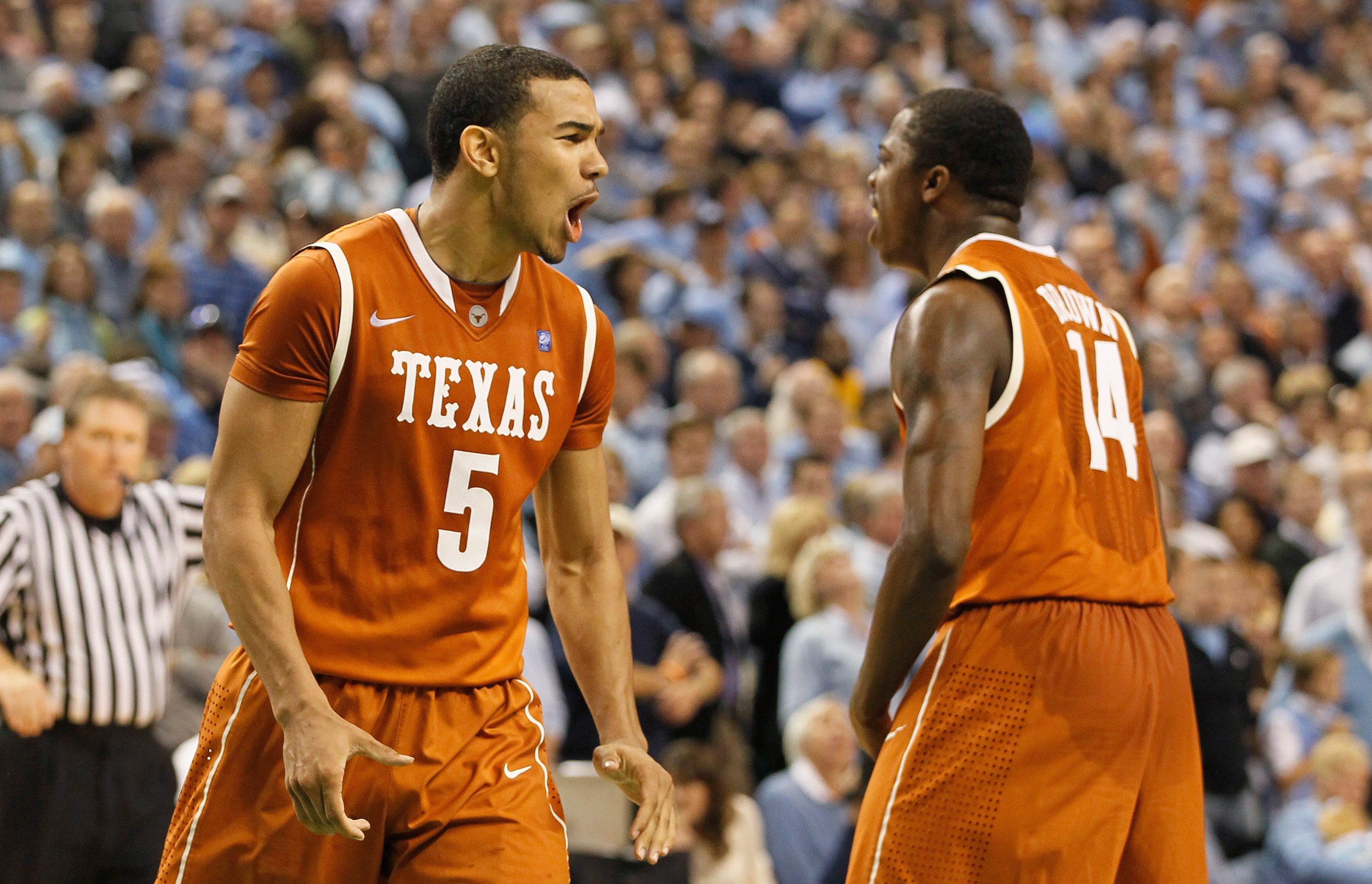 GREENSBORO, NC - DECEMBER 18:  Cory Joseph #5 of the Texas Longhorns reacts with J'Covan Brown #14 after Joseph hit what became the game-winning basket against the North Carolina Tar Heels Greensboro Coliseum on December 18, 2010 in Greensboro, North Caro