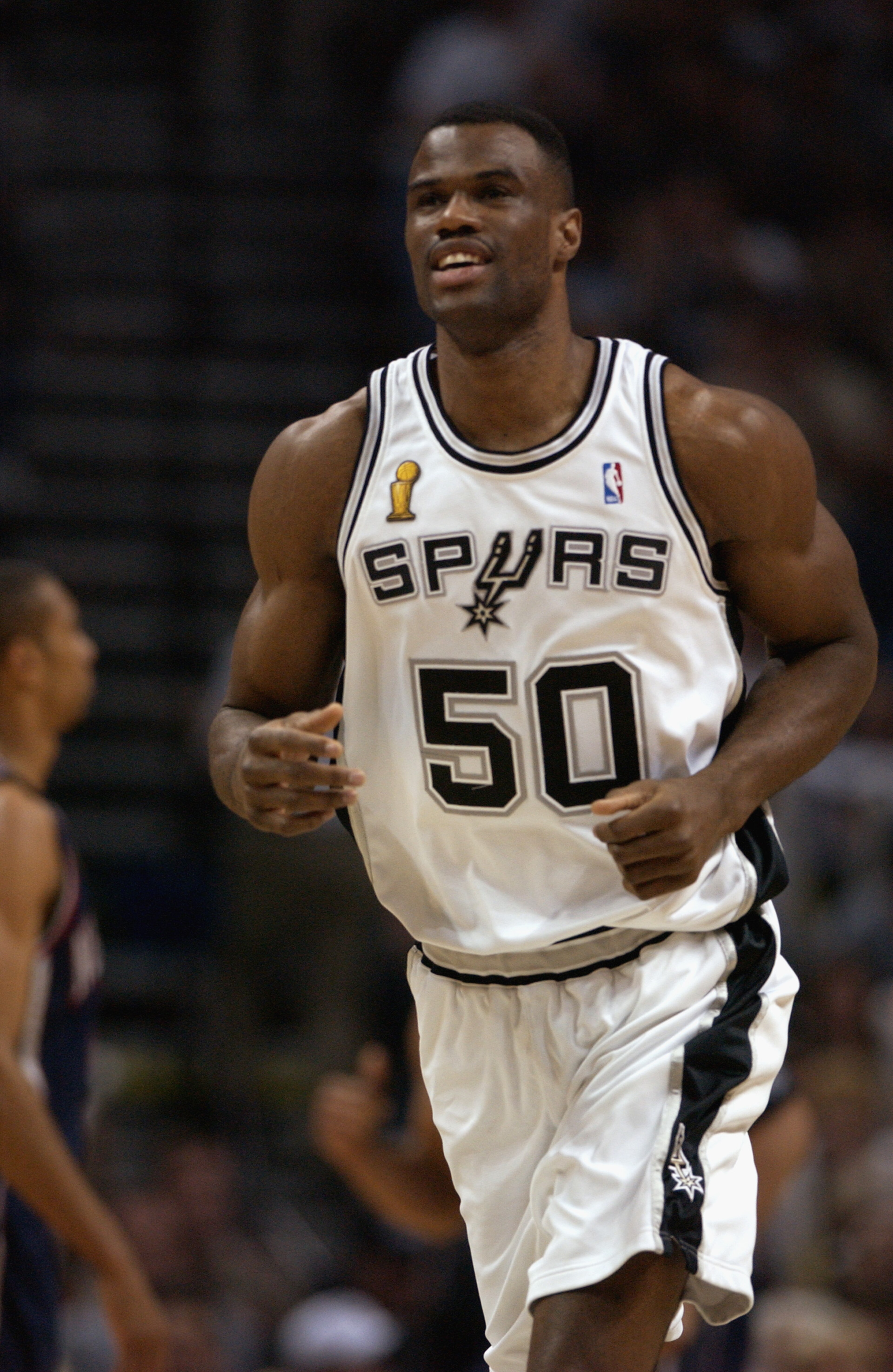 SAN ANTONIO - JUNE 6:  David Robinson #50 of the San Antonio Spurs runs during Game two of the 2003 NBA Finals against the New Jersey Nets at SBC Center on June 6, 2003 in San Antonio, Texas.  The Nets won 87-85.  NOTE TO USER: User expressly acknowledges