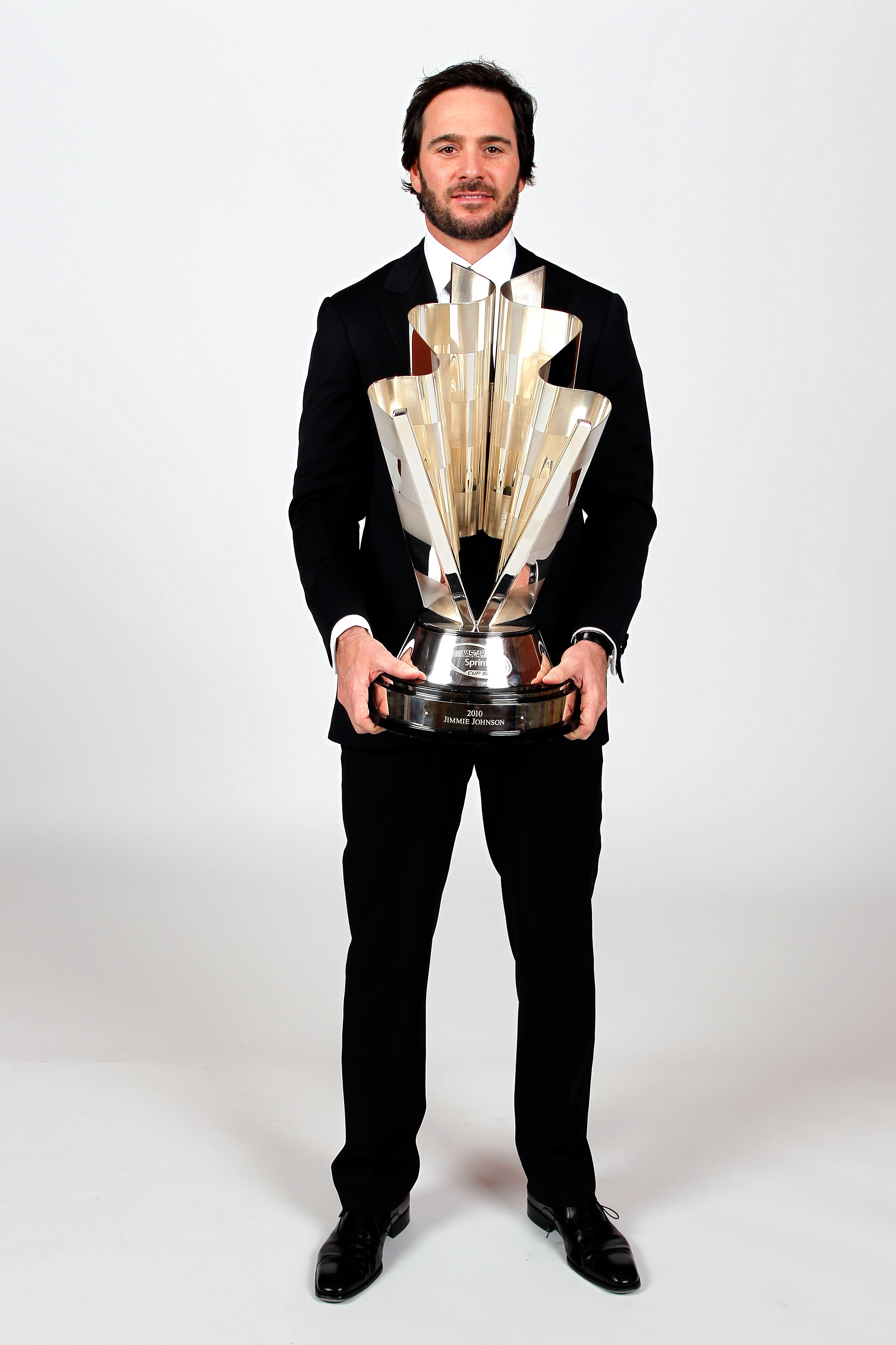 LAS VEGAS, NV - DECEMBER 03:  Five-time champion Jimmie Johnson poses with the Sprint Cup trophy during the NASCAR Sprint Cup Series awards banquet at the Wynn Las Vegas Hotel on December 3, 2010 in Las Vegas, Nevada.  (Photo by Todd Warshaw/Getty Images