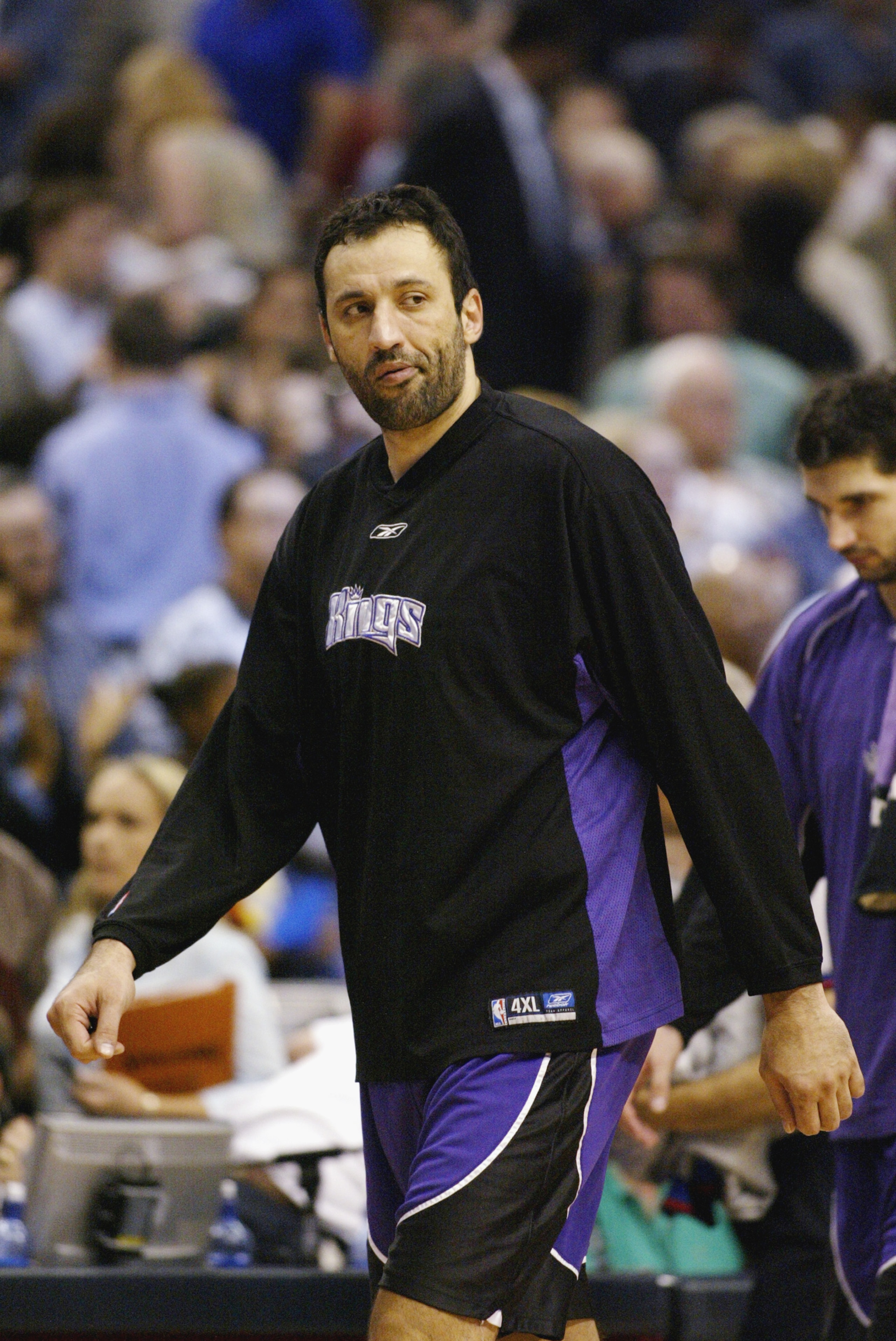 DALLAS - MAY 13:  Vlade Divac #21 of the the Sacramento Kings walks in Game five of the Western Conference Semifinals against the Dallas Mavericks during the 2003 NBA Playoffs at American Airlines Center on May 13, 2003 in Dallas, Texas.  The Mavericks wo