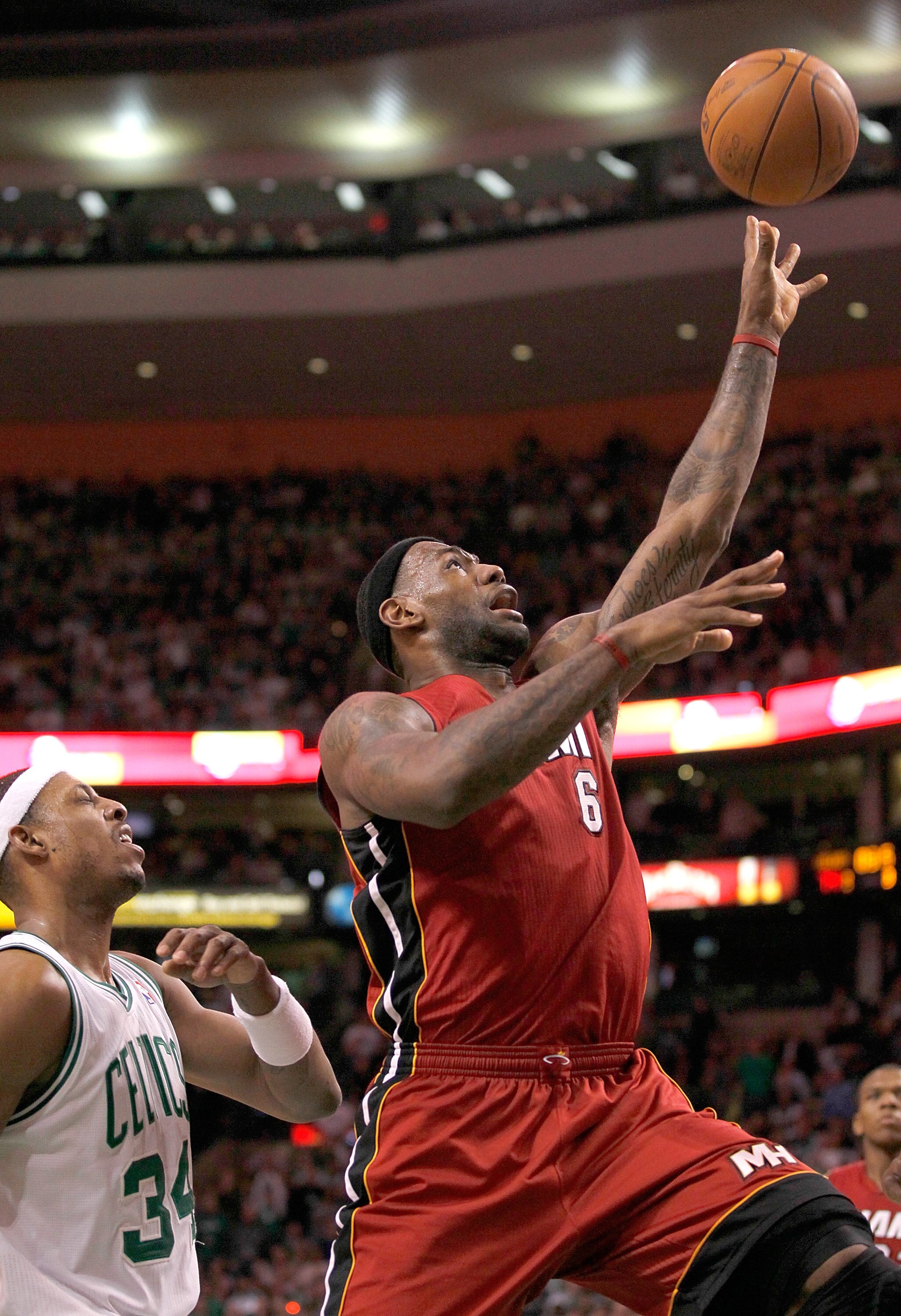 BOSTON - FEBRUARY 13:  LeBron James #6 of the Miami Heat drives  against Paul Pierce #34 of the Boston Celtics at TD Garden on February 13, 2011 in Boston, Massachusetts. Celtics won 85-82. NOTE TO USER: User expressly acknowledges and agrees that, by dow