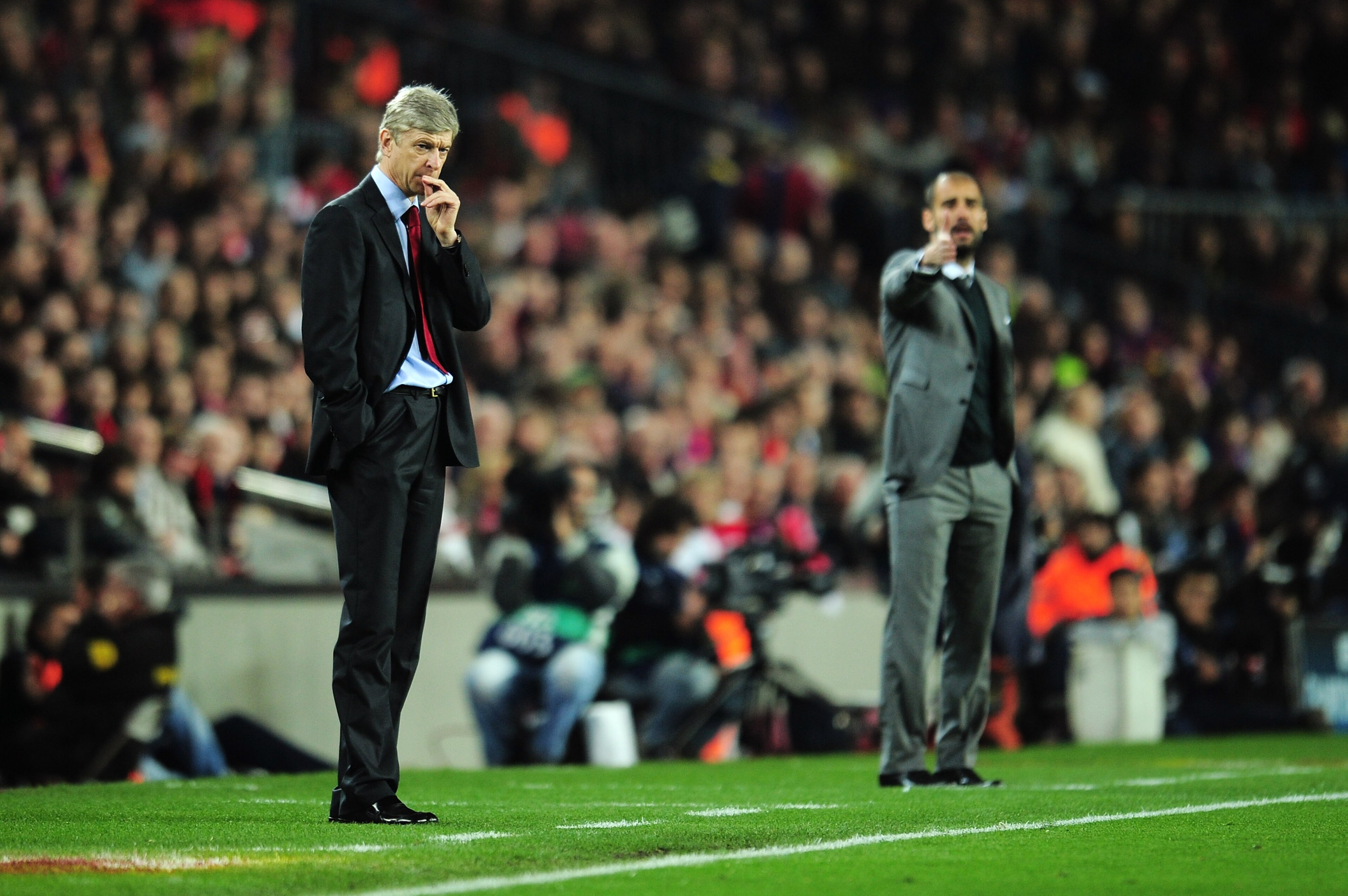 BARCELONA, SPAIN - APRIL 06: Manager of Arsenal Arsene Wenger and manager of Barcelona Josep Guardiola react on the touchline during the UEFA Champions League quarter final second leg match between Barcelona and Arsenal at Camp Nou on April 6, 2010 in Ba BARCELONA, SPAIN - APRIL 06: Manager of Arsenal Arsene Wenger and manager of Barcelona Josep Guardiola react on the touchline during the UEFA Champions League quarter final second leg match between Barcelona and Arsenal at Camp Nou on April 6, 2010 in Ba