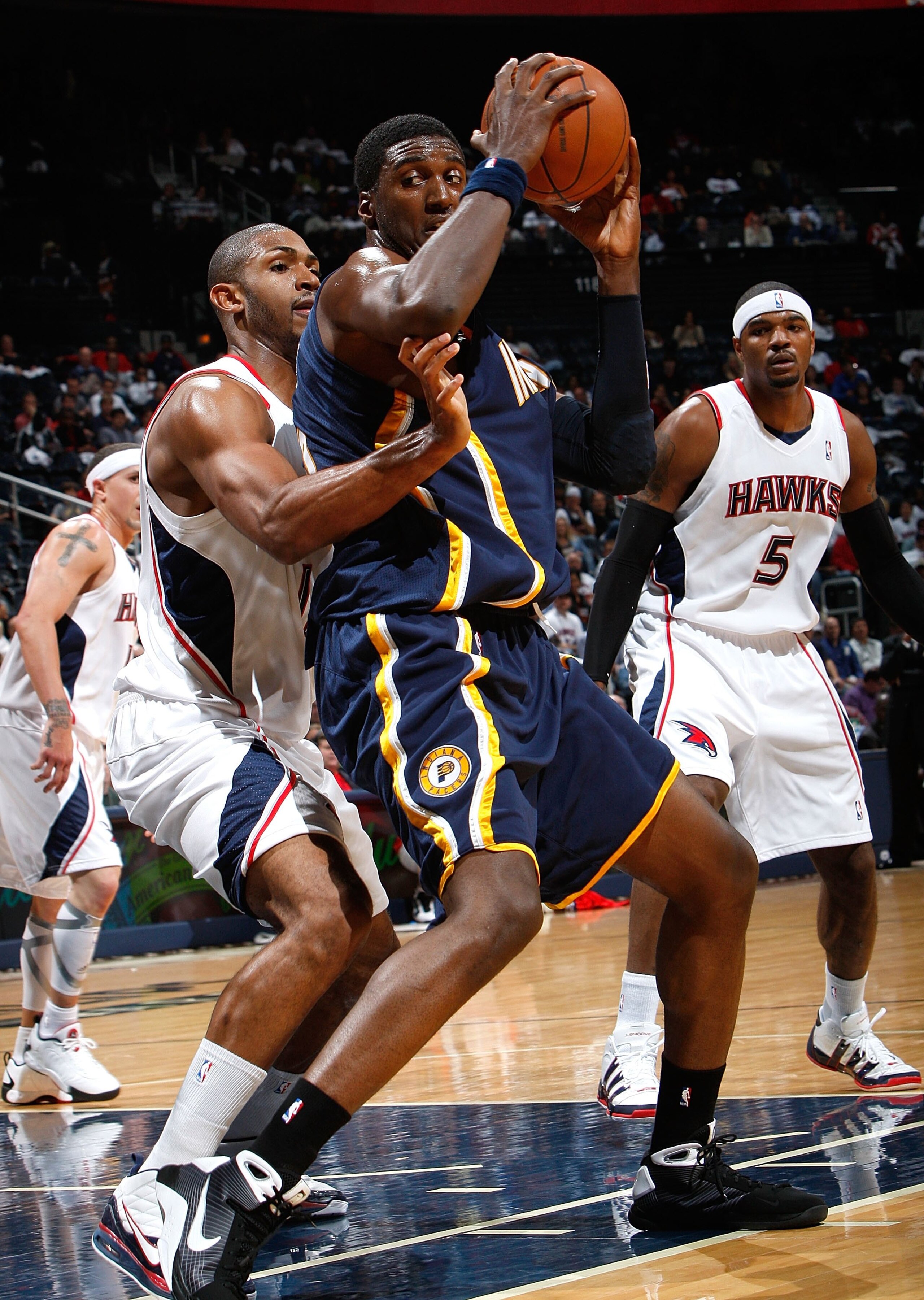 ATLANTA - OCTOBER 28:  Roy Hibbert #55 of the Indiana Pacers against Al Horford #15 of the Atlanta Hawks at Philips Arena on October 28, 2009 in Atlanta, Georgia.  (Photo by Kevin C. Cox/Getty Images)