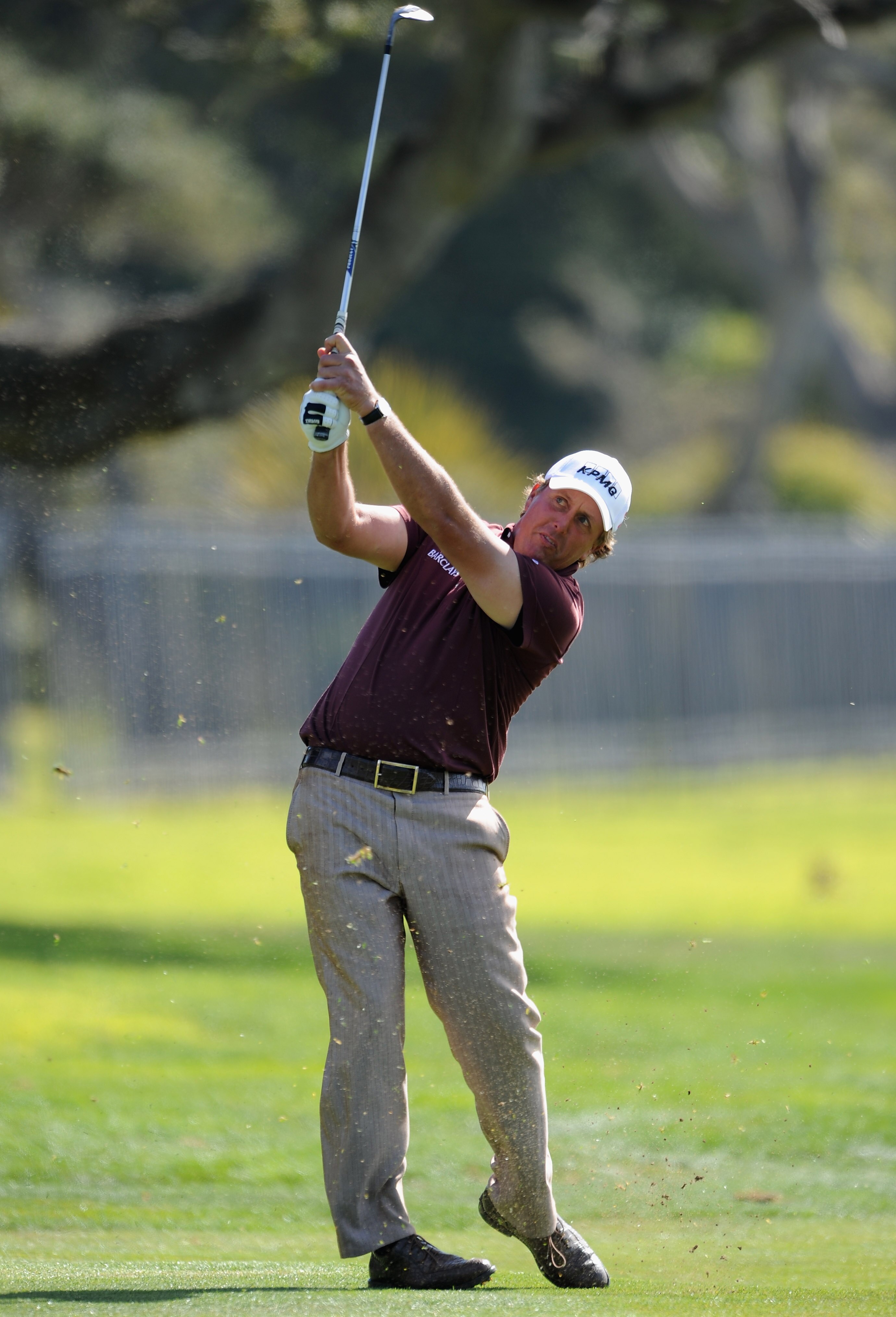 PEBBLE BEACH, CA - FEBRUARY 13:  Phil Mickelson plays his approach shot on the 14th hole during the final round of the AT&T Pebble Beach National Pro-Am at Pebble Beach Golf Links on February 13, 2011  in Pebble Beach, California.  (Photo by Stuart Frankl