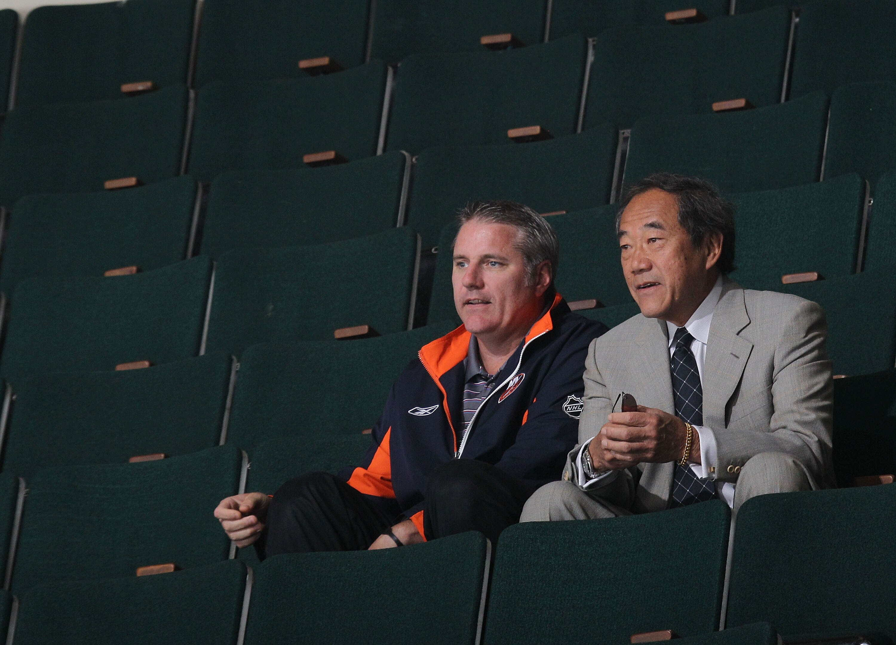 UNIONDALE, NY - JULY 07: General Manager Garth Snow and team owner Charles Wang watch the New York Islanders rookie camp at Nassau Veterans Memorial Coliseum on July 7, 2010 in Uniondale, New York. (Photo by Bruce Bennett/Getty Images)