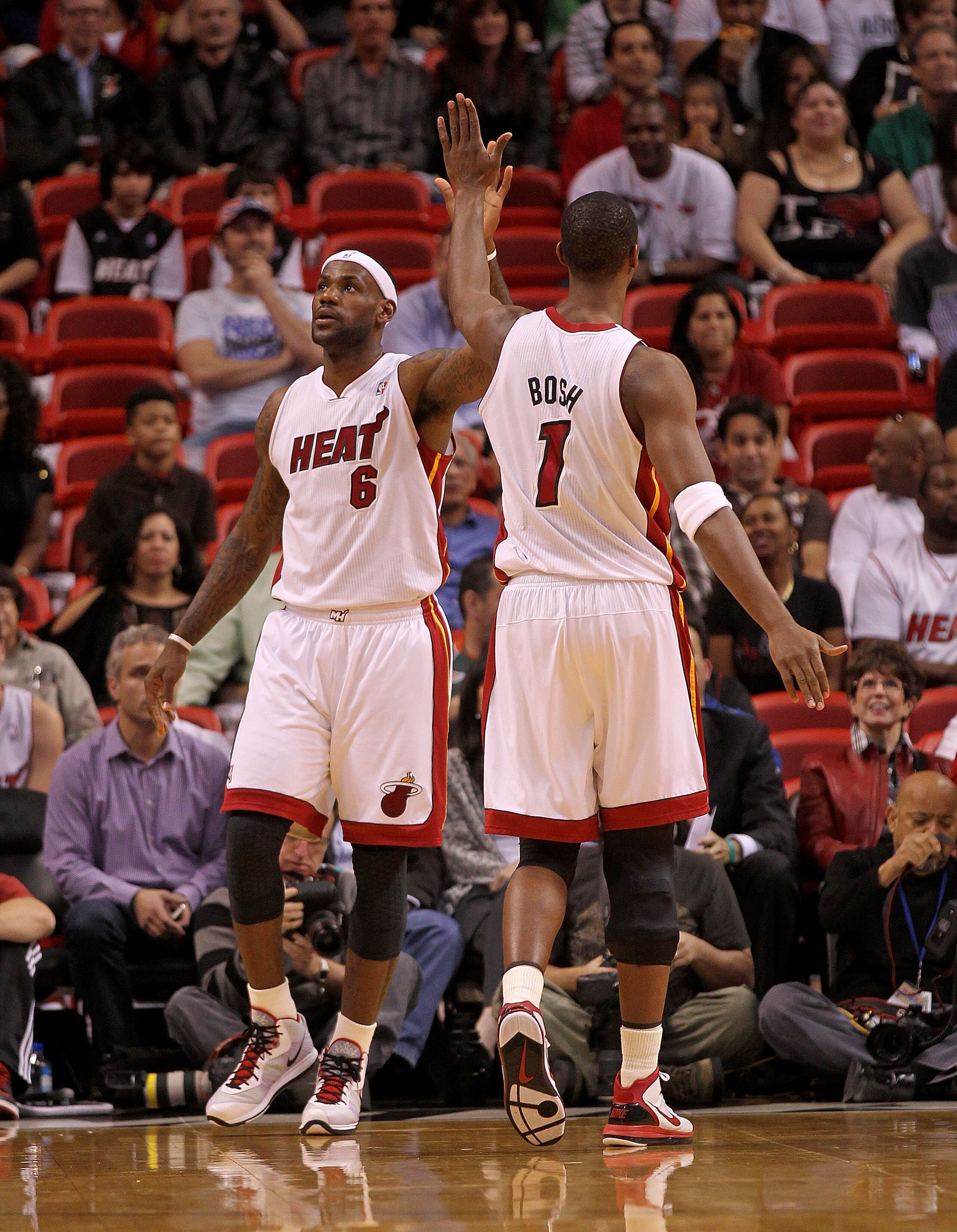 MIAMI, FL - FEBRUARY 08:  LeBron James #6 of the Miami Heatis congratulated by Chris Bosh #1 during a game against the Indiana Pacers at American Airlines Arena on February 8, 2011 in Miami, Florida. NOTE TO USER: User expressly acknowledges and agrees th