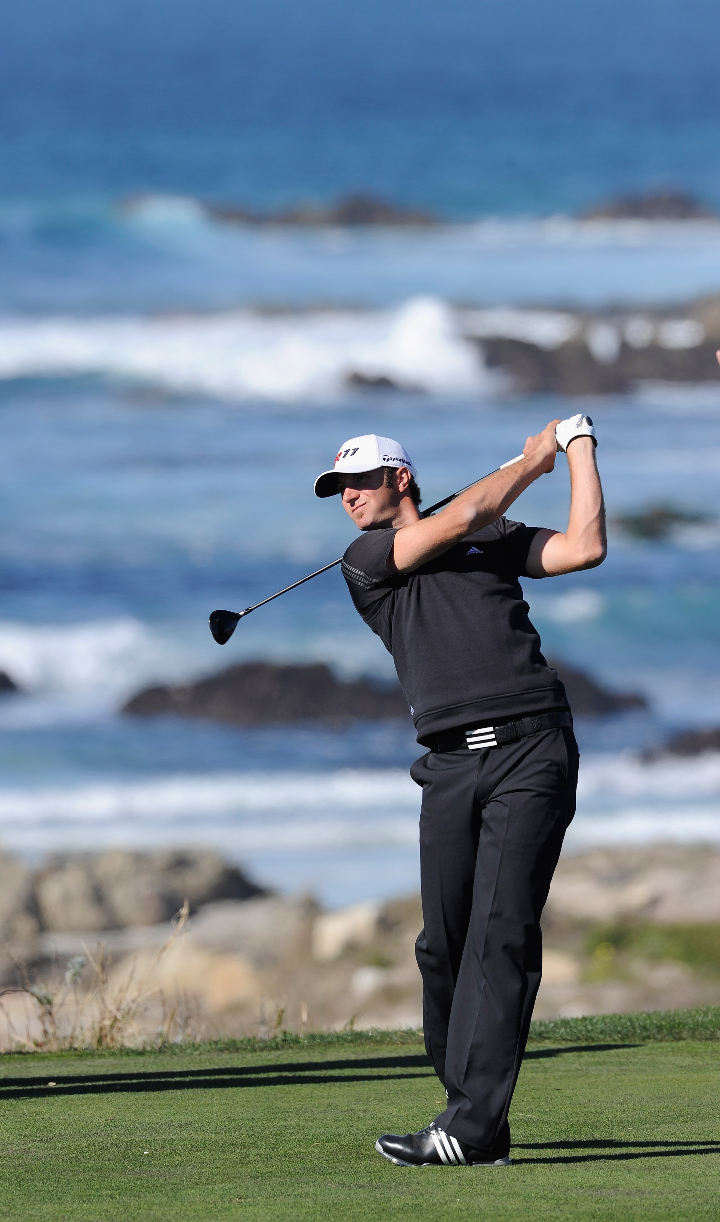 PEBBLE BEACH, CA - FEBRUARY 10:  Dustin Johnson plays a shot during the first round of the AT&T Pebble Beach National Pro-Am at Monterey Peninsula Country Club on February 10, 2011  in Pebble Beach, California.  (Photo by Stuart Franklin/Getty Images)