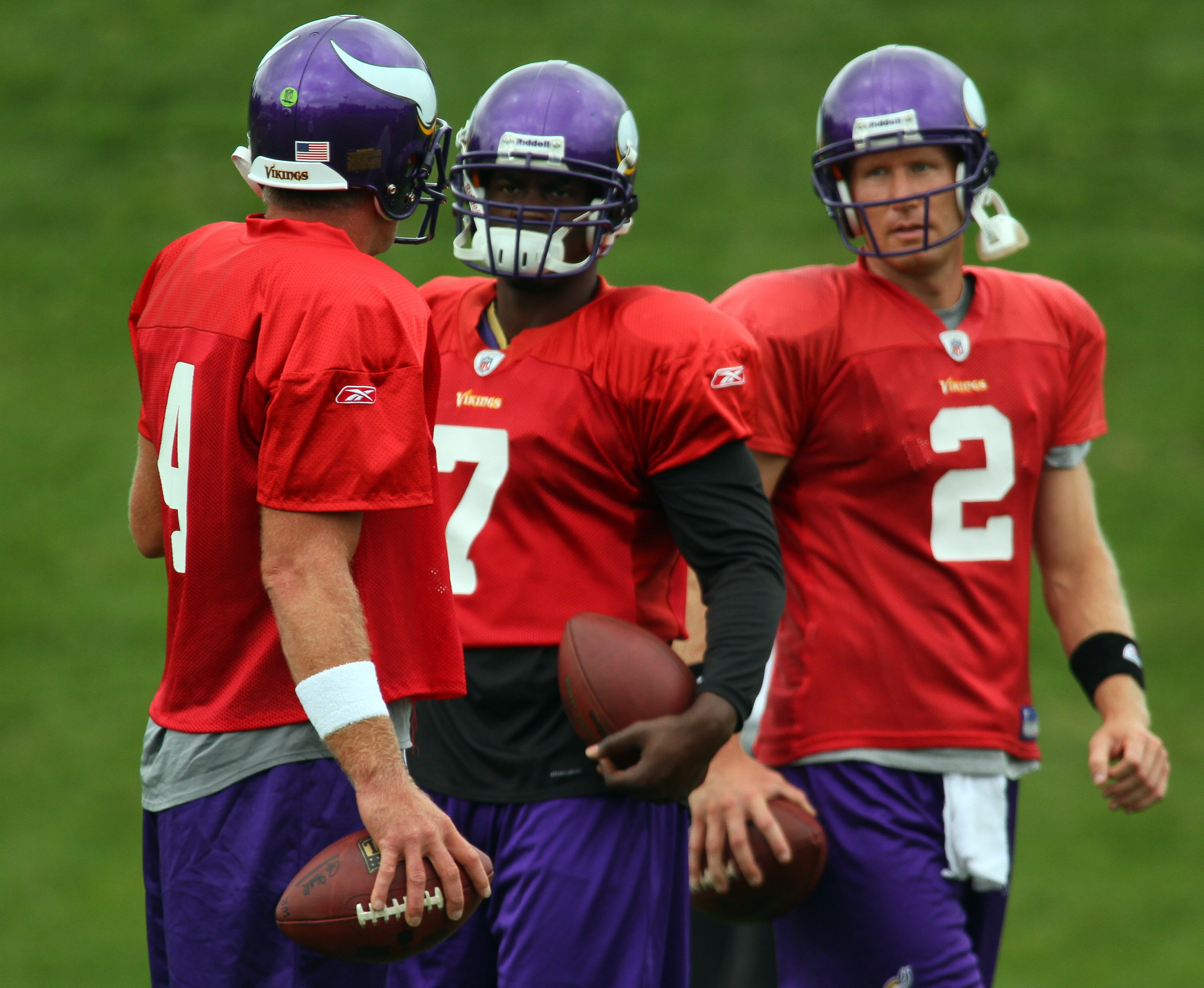 EDEN PRAIRIE, MN - AUGUST 18: Quarterbacks Brett Favre #4, Tarvaris Jackson #7 and Sage Rosenfels #2 of the Minnesota Vikings participate in Favre's first morning practice since returning to Vikings Winter Park on August 18, 2010 in Eden Prairie, Minnesot