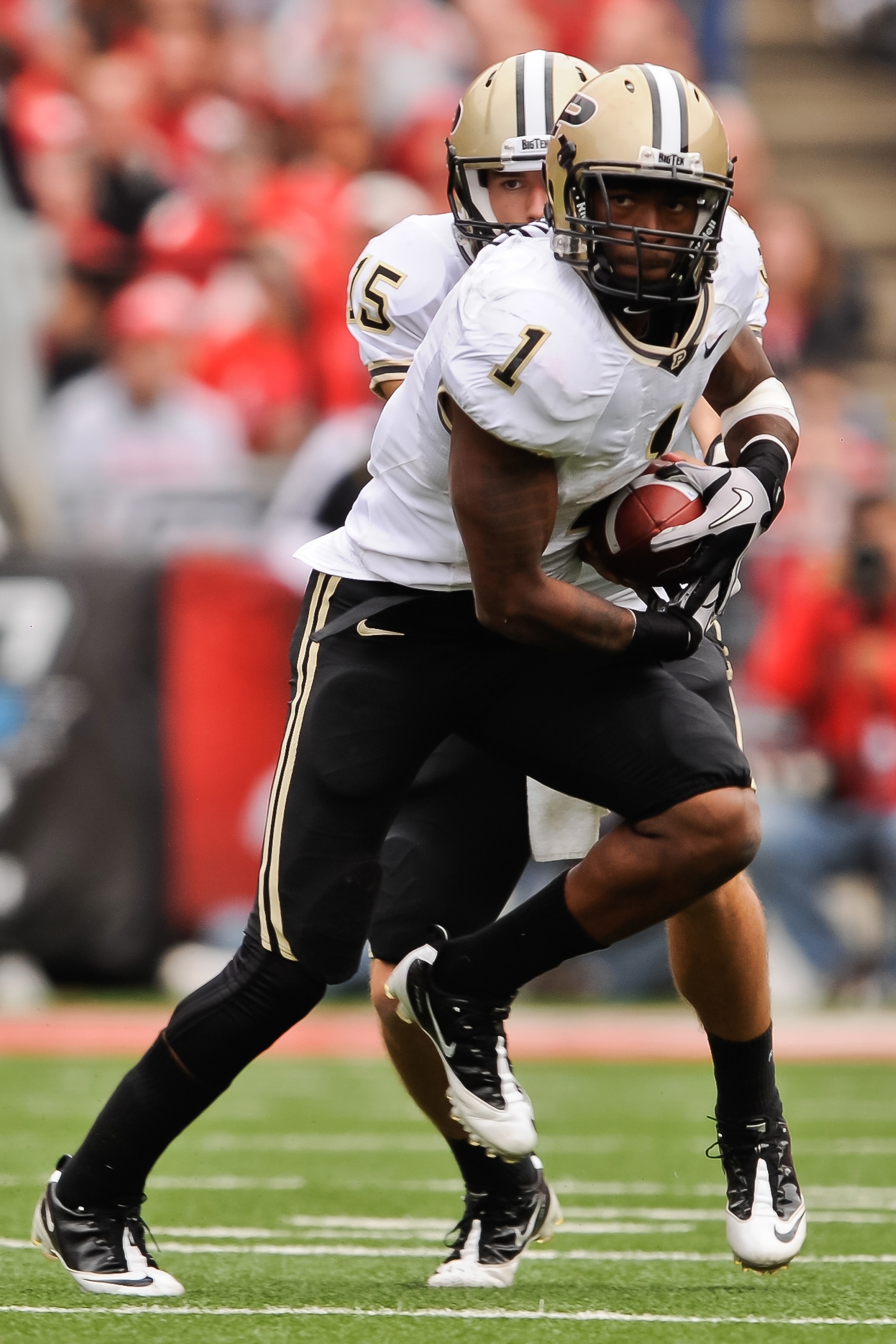 COLUMBUS, OH - OCTOBER 23:  Keith Carlos #1 of the Purdue Boilermakers takes a hand off against the Ohio State Buckeyes at Ohio Stadium on October 23, 2010 in Columbus, Ohio.  (Photo by Jamie Sabau/Getty Images)