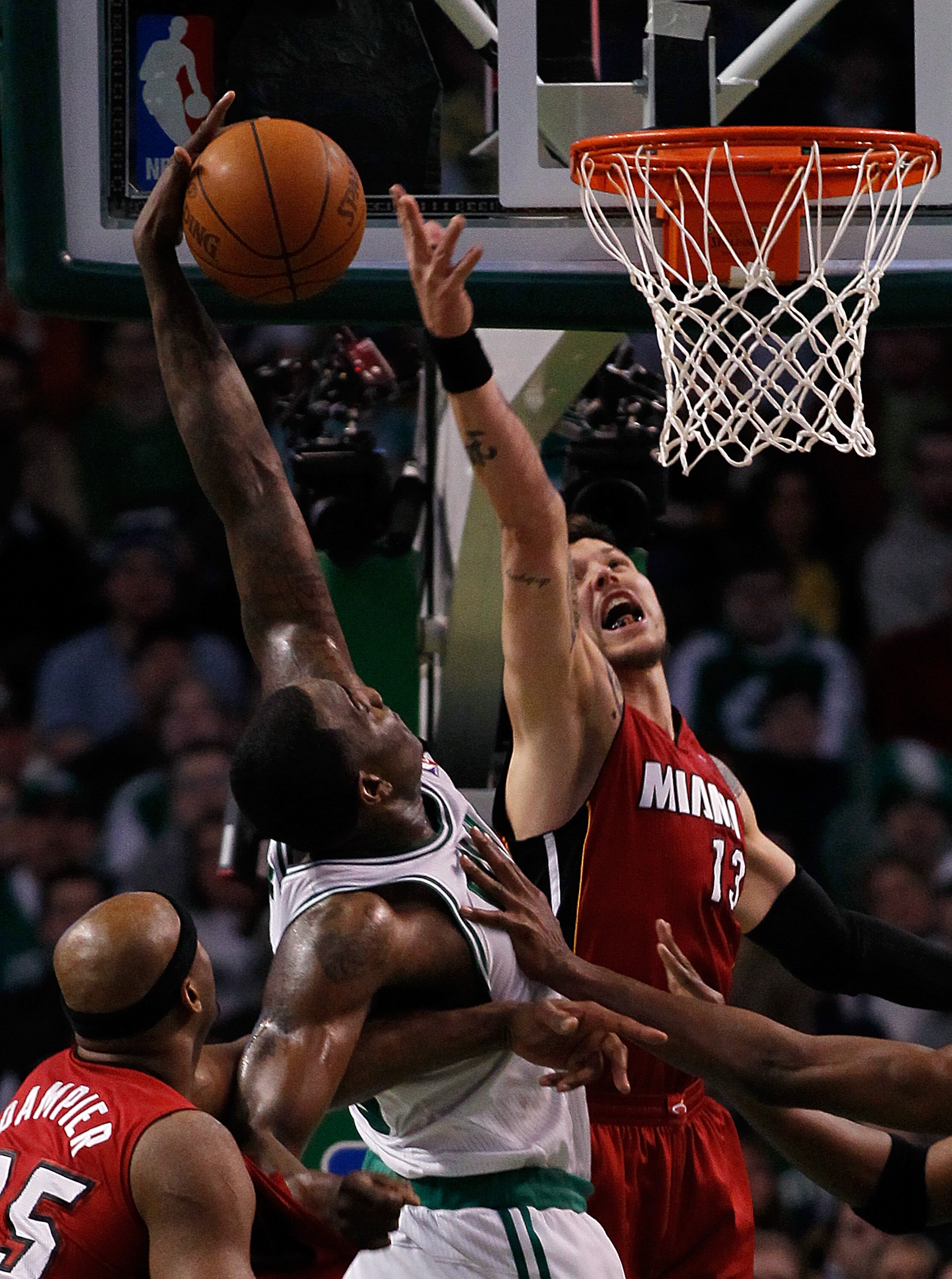 BOSTON - FEBRUARY 13:  Dexter Pittman #13 of the Miami Heat defends against Kendrick Perkins #43 of the Boston Celtics at TD Garden on February 13, 2011 in Boston, Massachusetts. NOTE TO USER: User expressly acknowledges and agrees that, by downloading an
