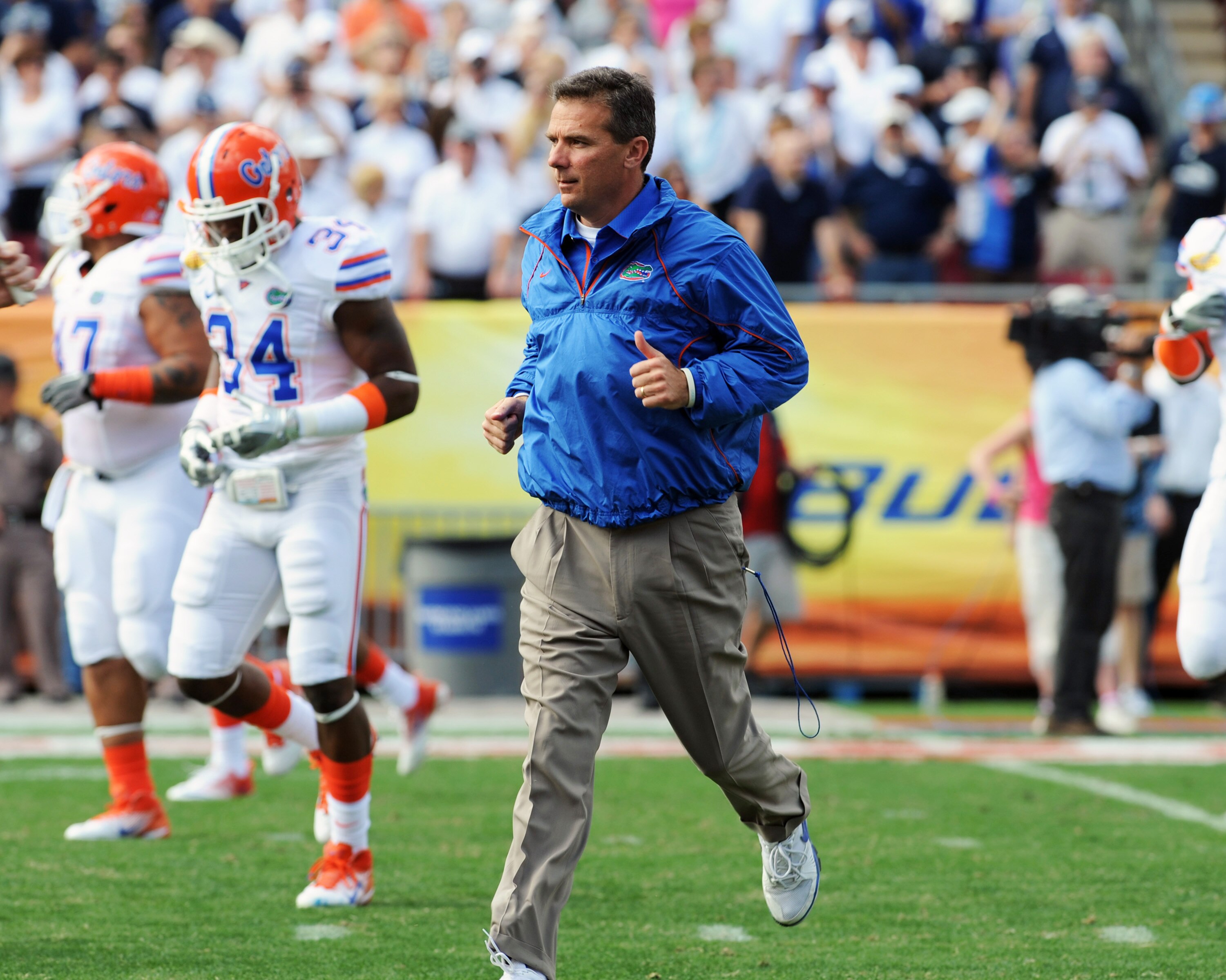 TAMPA, FL - JANUARY 1:  Coach Urban Meyer of the Florida Gators takes the field for play against the Penn State Nittany Lions January 1, 2010 in the 25th Outback Bowl at Raymond James Stadium in Tampa, Florida.  (Photo by Al Messerschmidt/Getty Images)