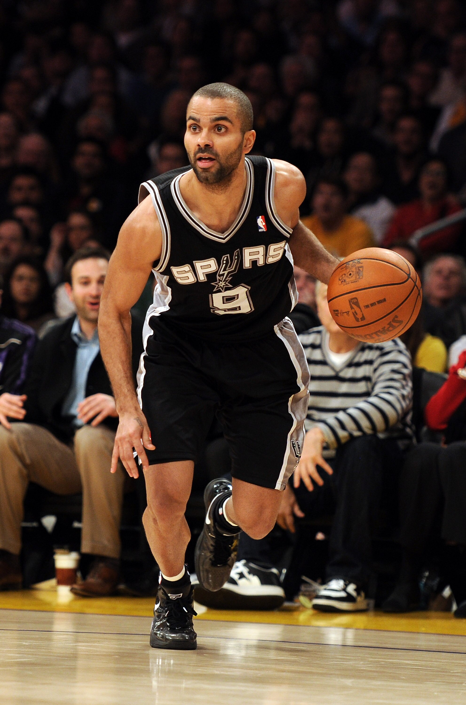 LOS ANGELES, CA - FEBRUARY 03:  Tony Parker #9 of the San Antonio Spurs dribbles from the corner against the Los Angeles Lakers at Staples Center on February 3, 2011 in Los Angeles, California.  NOTE TO USER: User expressly acknowledges and agrees that, b