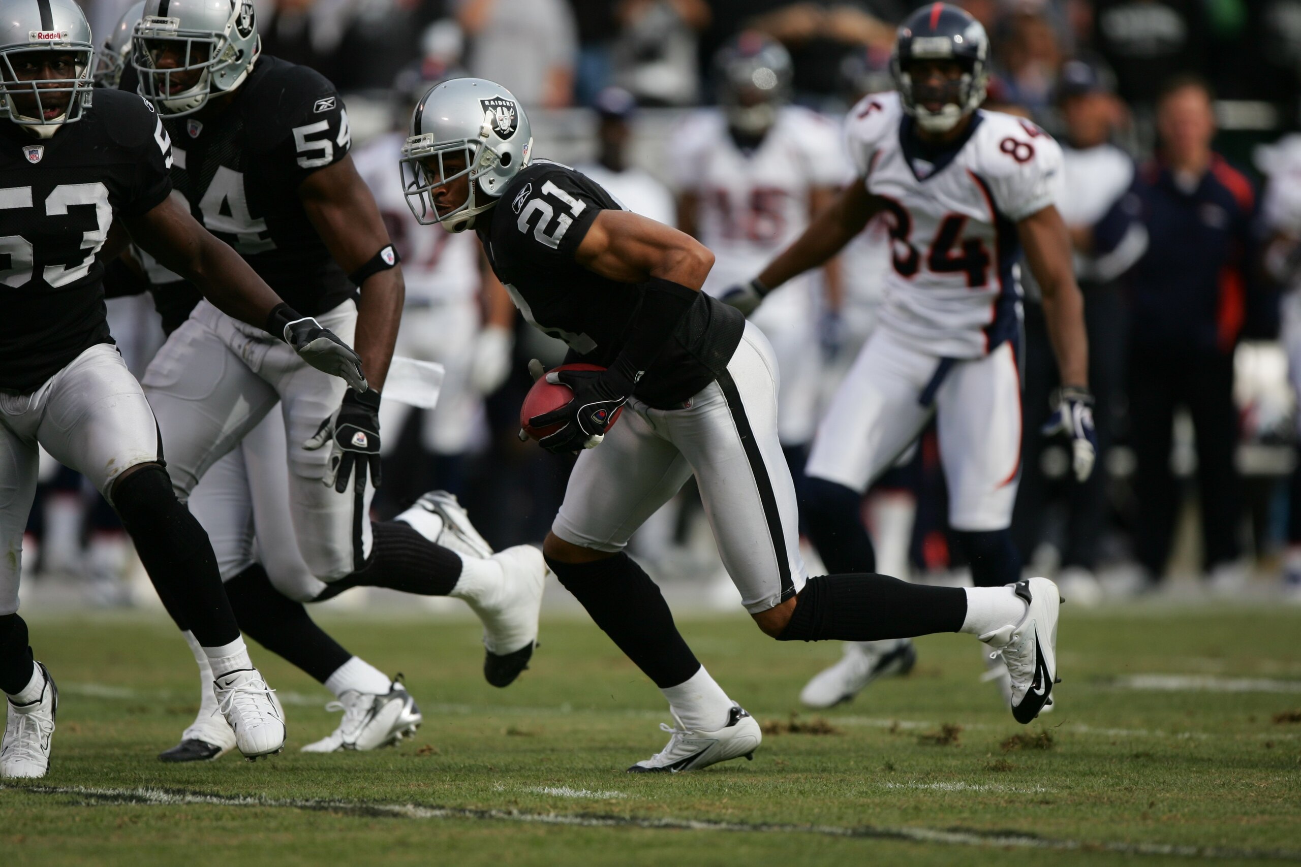 OAKLAND, CA - NOVEMBER 12: Cornerback Nnamdi Asomugha #21 of the Oakland Raiders returns an interception against the Denver Broncos at McAfee Coliseum on November 12, 2006 in Oakland, California. The Broncos defeated the Raiders 17-13. (Photo by Jed Jaco OAKLAND, CA - NOVEMBER 12: Cornerback Nnamdi Asomugha #21 of the Oakland Raiders returns an interception against the Denver Broncos at McAfee Coliseum on November 12, 2006 in Oakland, California. The Broncos defeated the Raiders 17-13. (Photo by Jed Jaco