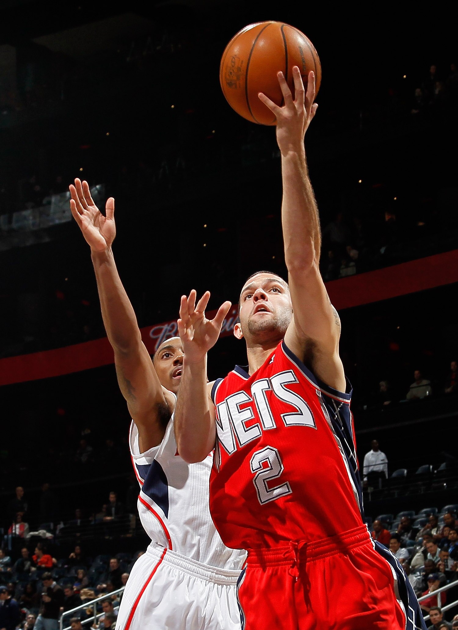 ATLANTA, GA - DECEMBER 07:  Jordan Farmar #2 of the New Jersey Nets drives the basket past Jeff Teague #0 of the Atlanta Hawks at Philips Arena on December 7, 2010 in Atlanta, Georgia.  NOTE TO USER: User expressly acknowledges and agrees that, by downloa