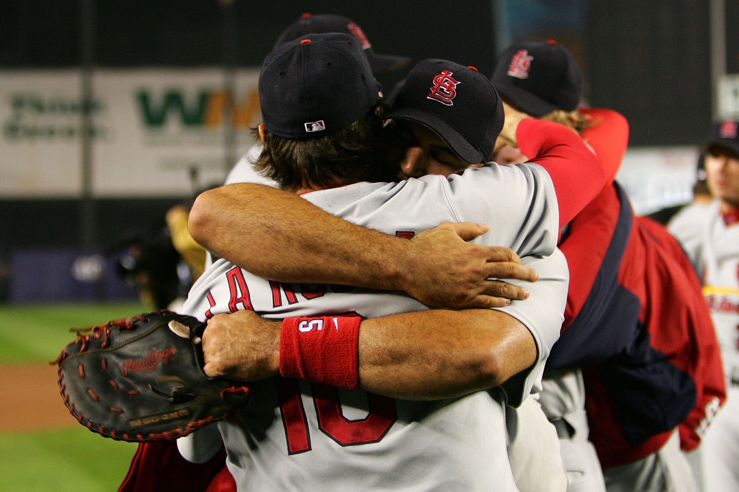 NEW YORK - OCTOBER 19: Albert Pujols #5 and manager Tony LaRussa #10 of the St. Louis Cardinals embrace after defeating the New York Mets 3 to 1 in game seven of the NLCS at Shea Stadium on October 19, 2006 in the Flushing neighborhood of the Queens borou NEW YORK - OCTOBER 19: Albert Pujols #5 and manager Tony LaRussa #10 of the St. Louis Cardinals embrace after defeating the New York Mets 3 to 1 in game seven of the NLCS at Shea Stadium on October 19, 2006 in the Flushing neighborhood of the Queens borou