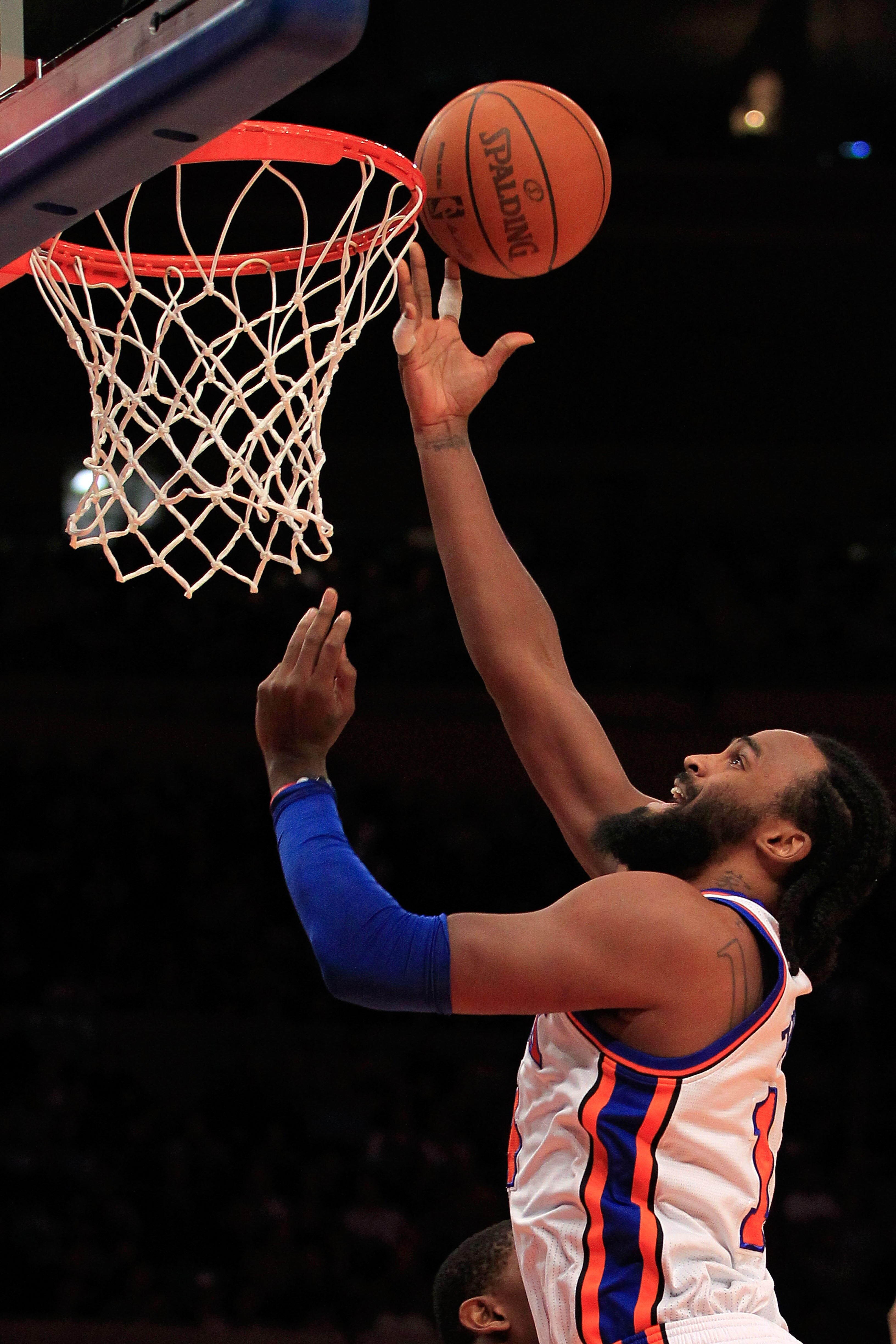 NEW YORK, NY - JANUARY 24 : Ronny Turiaf #14 of the New York Knicks lays the ball up against the Washington Wizards at Madison Square Garden on January 24, 2011 in New York City. NOTE TO USER: User expressly acknowledges and agrees that, by downloading an