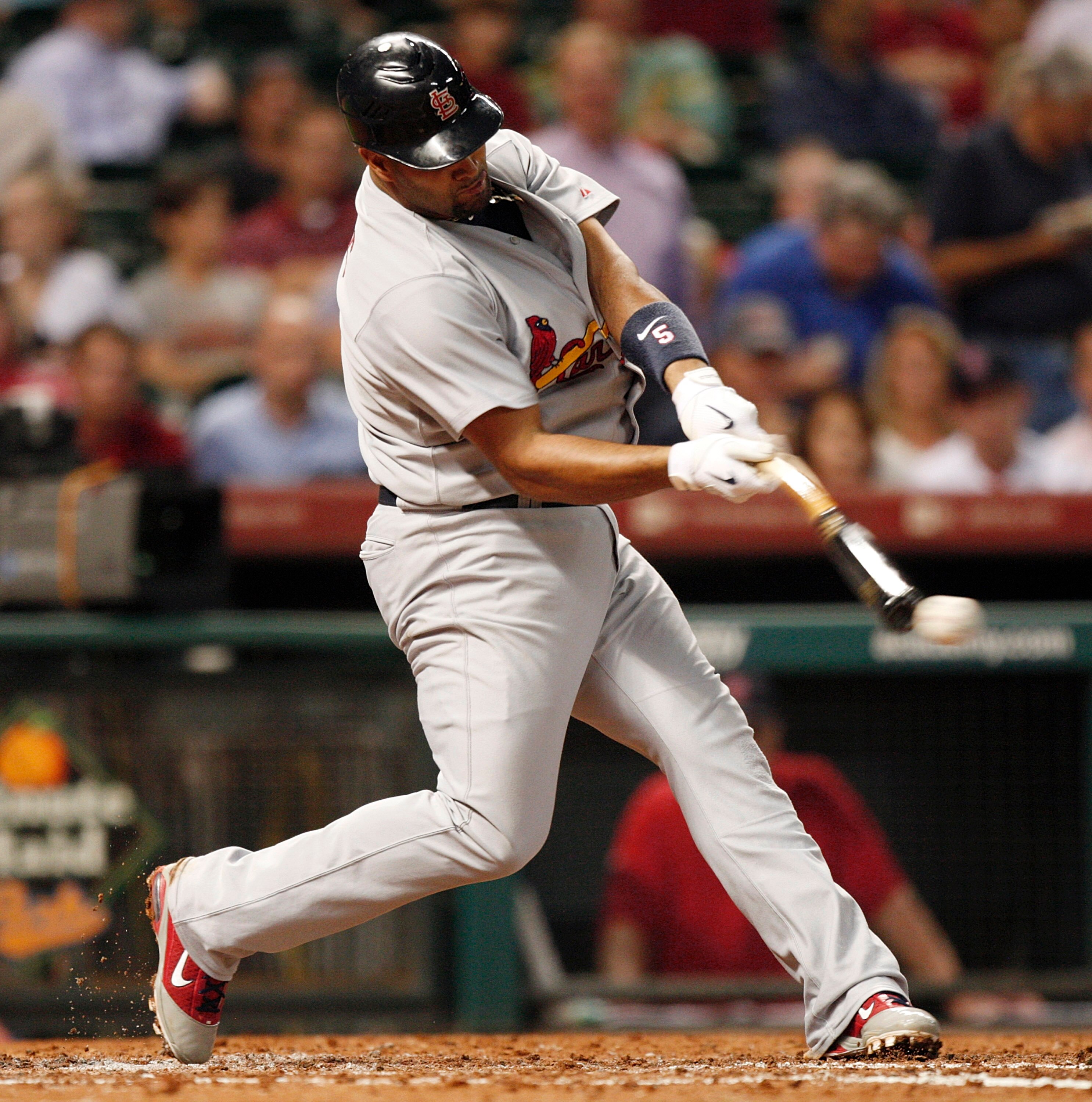 HOUSTON - AUGUST 30:  Albert Pujols #5 of the St. Louis Cardinals hits the ball off the end of the bat during a baseball game against the Houston Astros at Minute Maid Park on August 30, 2010 in Houston, Texas. The Astros beat the Cardinals 3-0.  (Photo b
