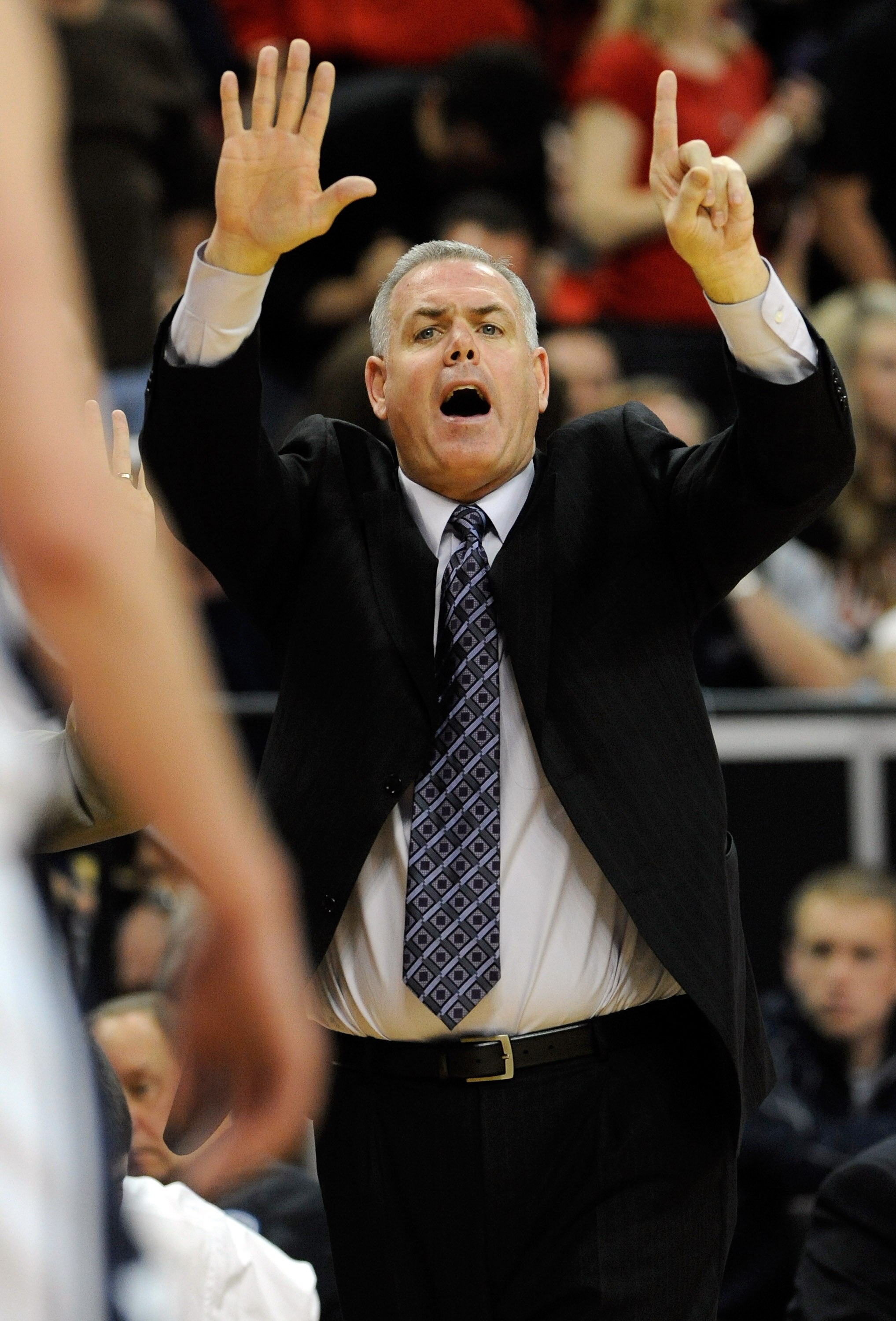 LAS VEGAS - MARCH 12:  Head coach Dave Rose of the Brigham Young University Cougars signals his players during a semifinal game against the UNLV Rebels at the Conoco Mountain West Conference Basketball tournament at the Thomas & Mack Center March 12, 2010
