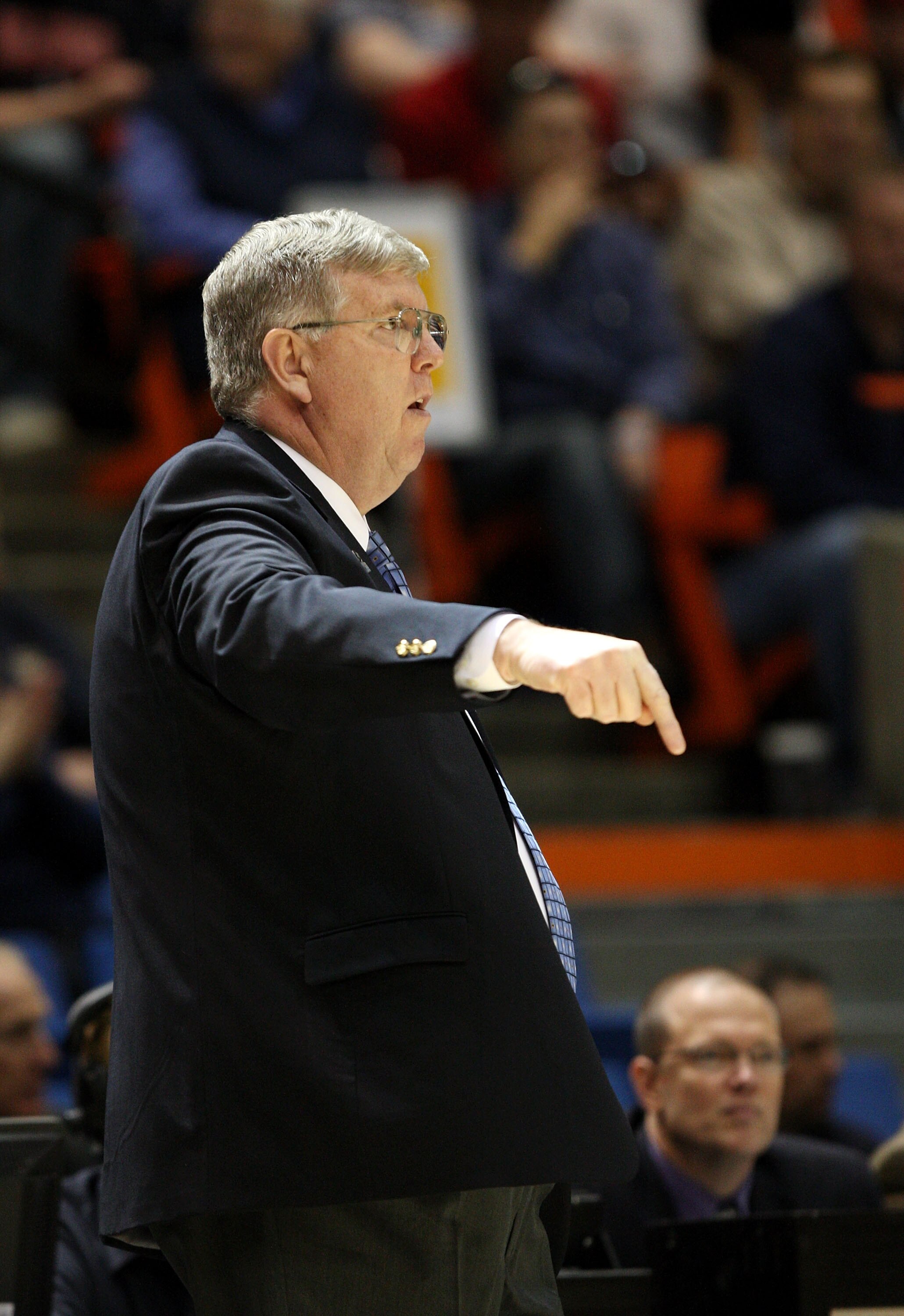 BOISE, ID - MARCH 20:  Head Coach Stew Morrill of the Utah State Aggies adjusts his team during the game against the Marquette Golden Eagles in the first round of the NCAA Division I Men's Basketball Tournament at the Taco Bell Arena on March 20, 2009 in