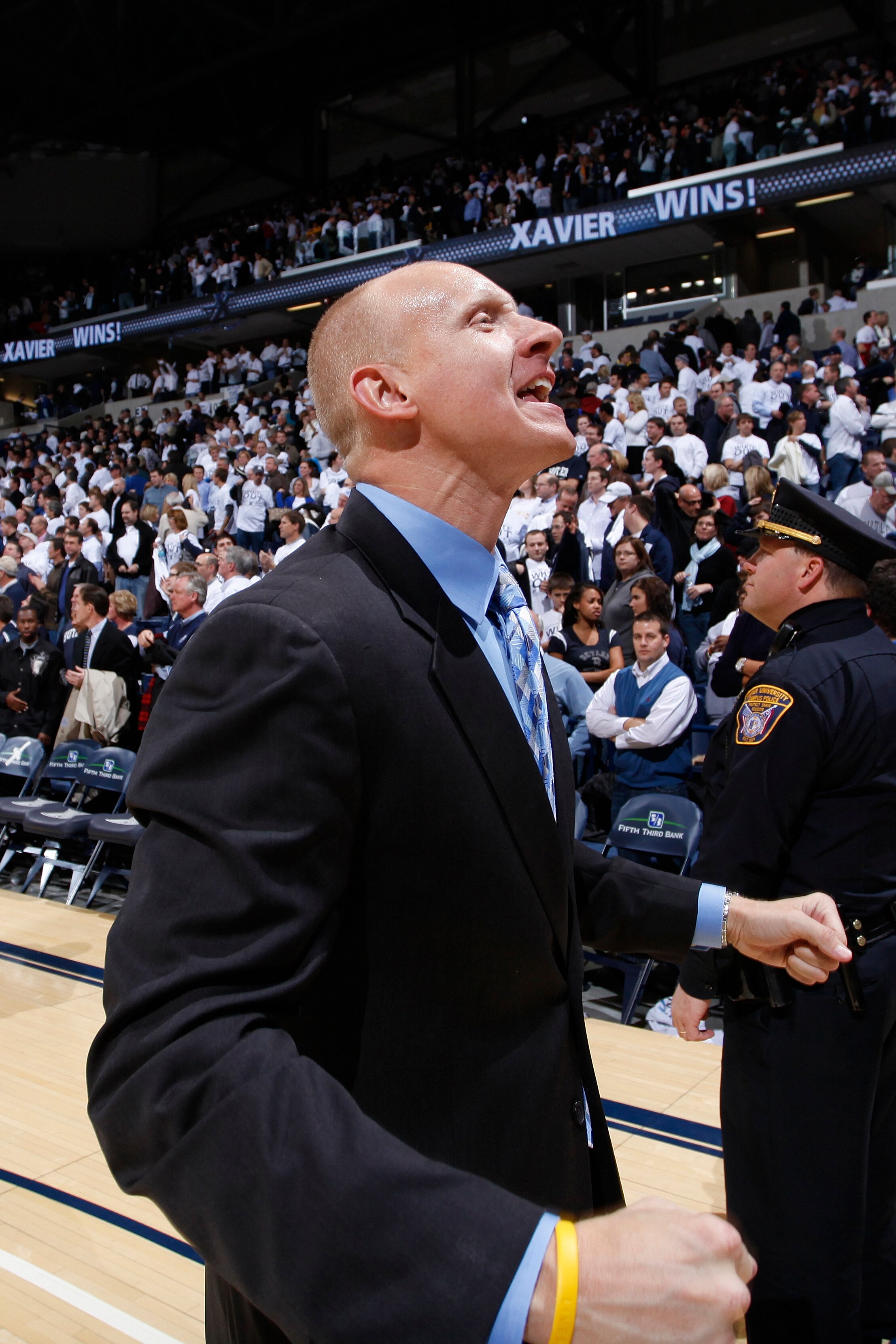 CINCINNATI, OH - DECEMBER 9: Xavier Musketeers head coach Chris Mack celebrates after the game against the Butler Bulldogs at Cintas Center on December 9, 2010 in Cincinnati, Ohio. Xavier defeated Butler 51-49. (Photo by Joe Robbins/Getty Images)