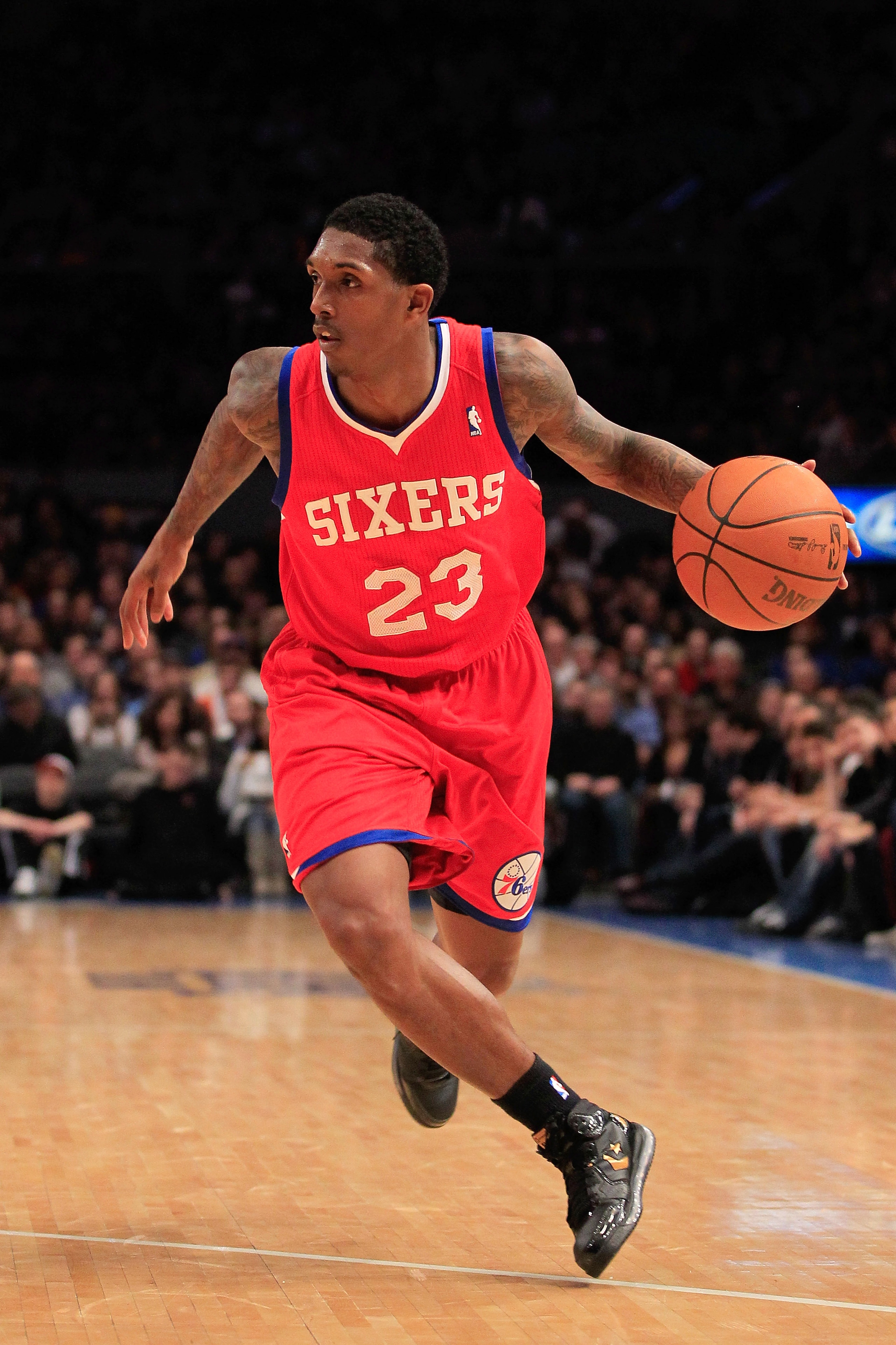 NEW YORK, NY - FEBRUARY 06:  Louis Williams #23 of the Philadelphia 76ers dribbles the ball against the New York Knicks at Madison Square Garden on February 6, 2011 in New York City. NOTE TO USER: User expressly acknowledges and agrees that, by downloadin