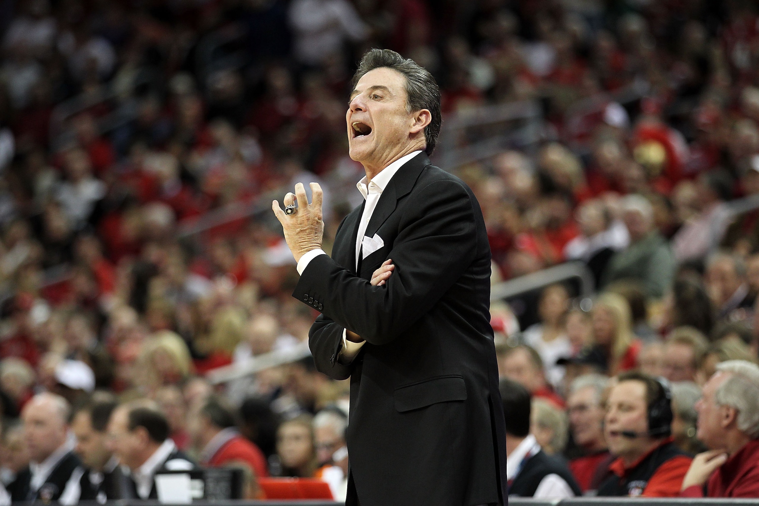 LOUISVILLE, KY - FEBRUARY 12: Rick Pitino the Head Coach of the Louisville Cardinals gives instructions to his team during the Big East Conference game against the Syracuse Orange at the KFC Yum! Center on February 12, 2011 in Louisville, Kentucky. Loui LOUISVILLE, KY - FEBRUARY 12: Rick Pitino the Head Coach of the Louisville Cardinals gives instructions to his team during the Big East Conference game against the Syracuse Orange at the KFC Yum! Center on February 12, 2011 in Louisville, Kentucky. Loui