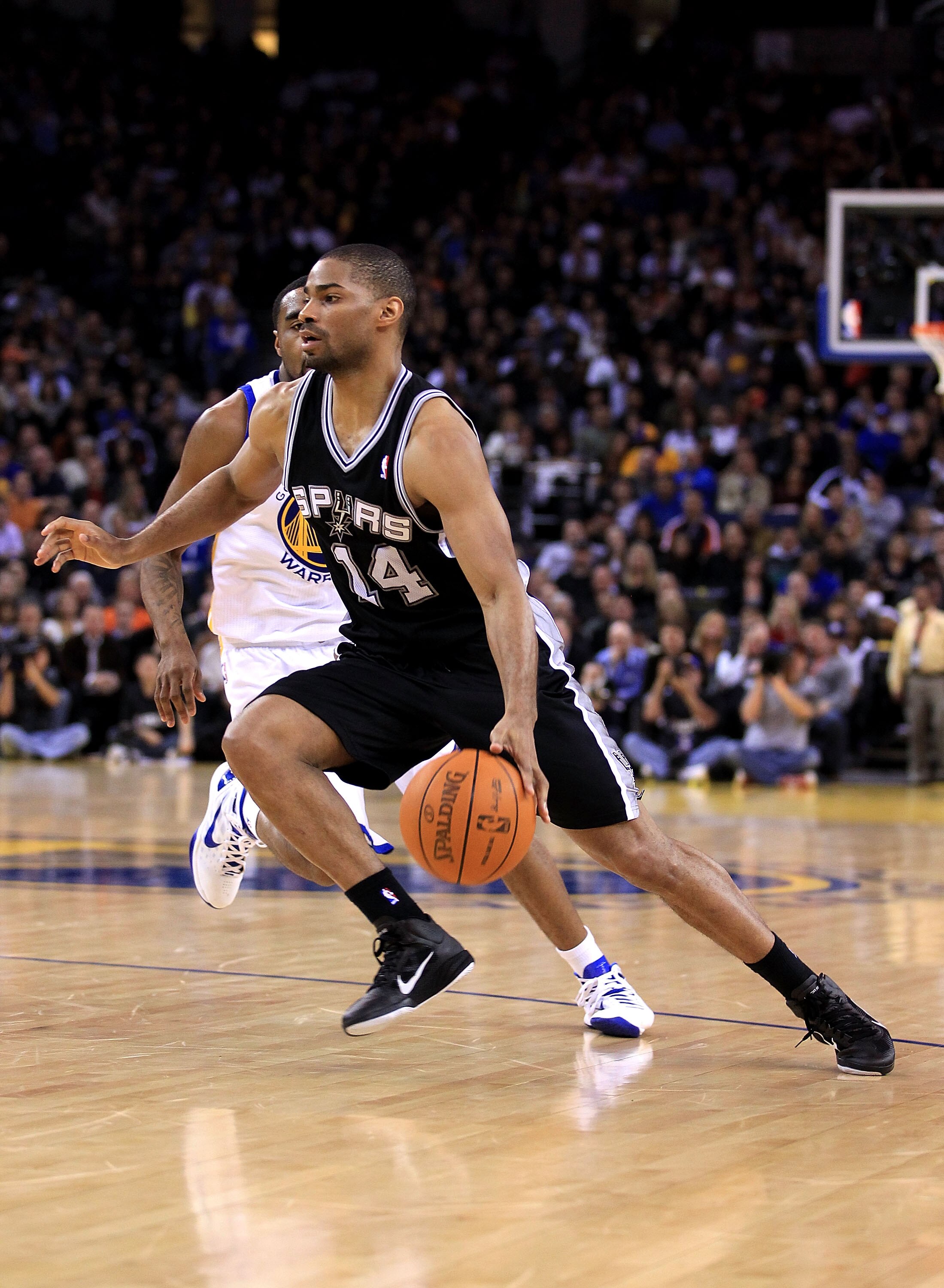 OAKLAND, CA - JANUARY 24:  Gary Neal #14 of the San Antonio Spurs in action against the Golden State Warriors at Oracle Arena on January 24, 2011 in Oakland, California.  NOTE TO USER: User expressly acknowledges and agrees that, by downloading and or usi