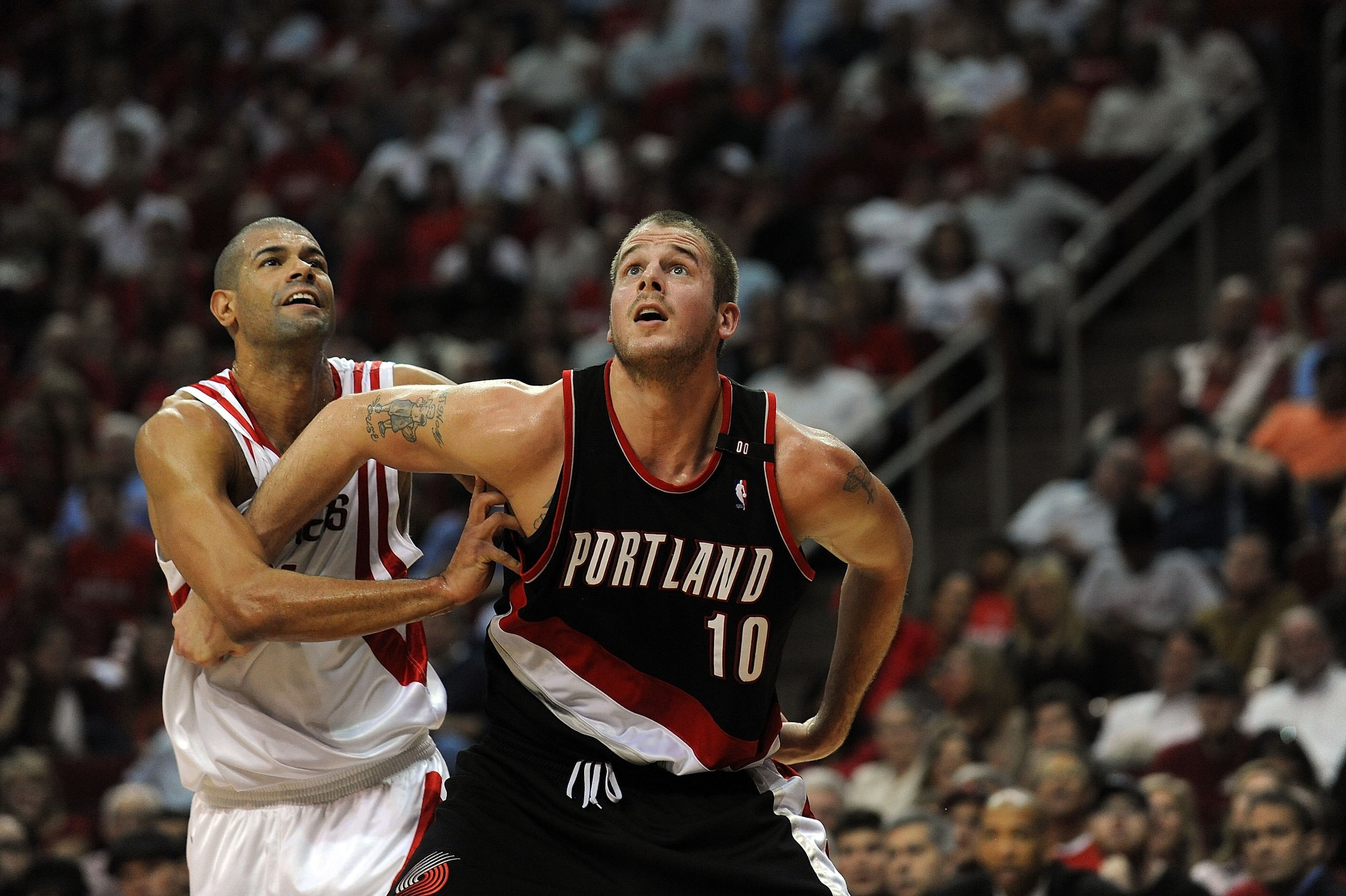 HOUSTON - APRIL 30:  Forward Joel Przybilla #10 of the Portland Trail Blazers and Shane Battier #5 of the Houston Rockets in Game Six of the Western Conference Quarterfinals during the 2009 NBA Playoffs at Toyota Center on April 30, 2009 in Houston, Texas