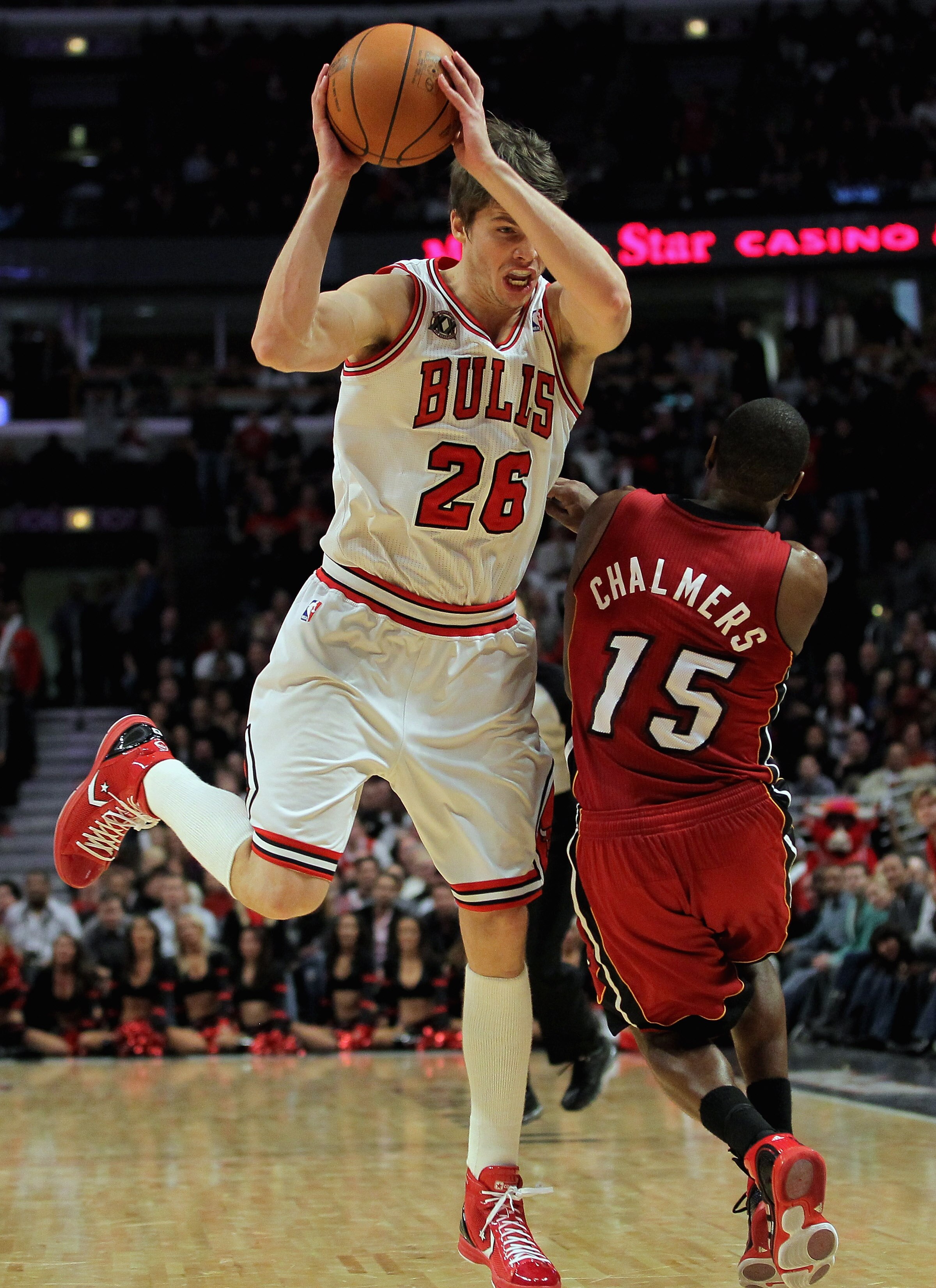 CHICAGO, IL - JANUARY 15:  Kyle Korver #26 of the Chicago Bulls collects a rebound and sets up for the game winning three point field goal with 25 seconds remaining in the game against Mario Chamlers #15 of the Miami Heat at the United Center on January 1