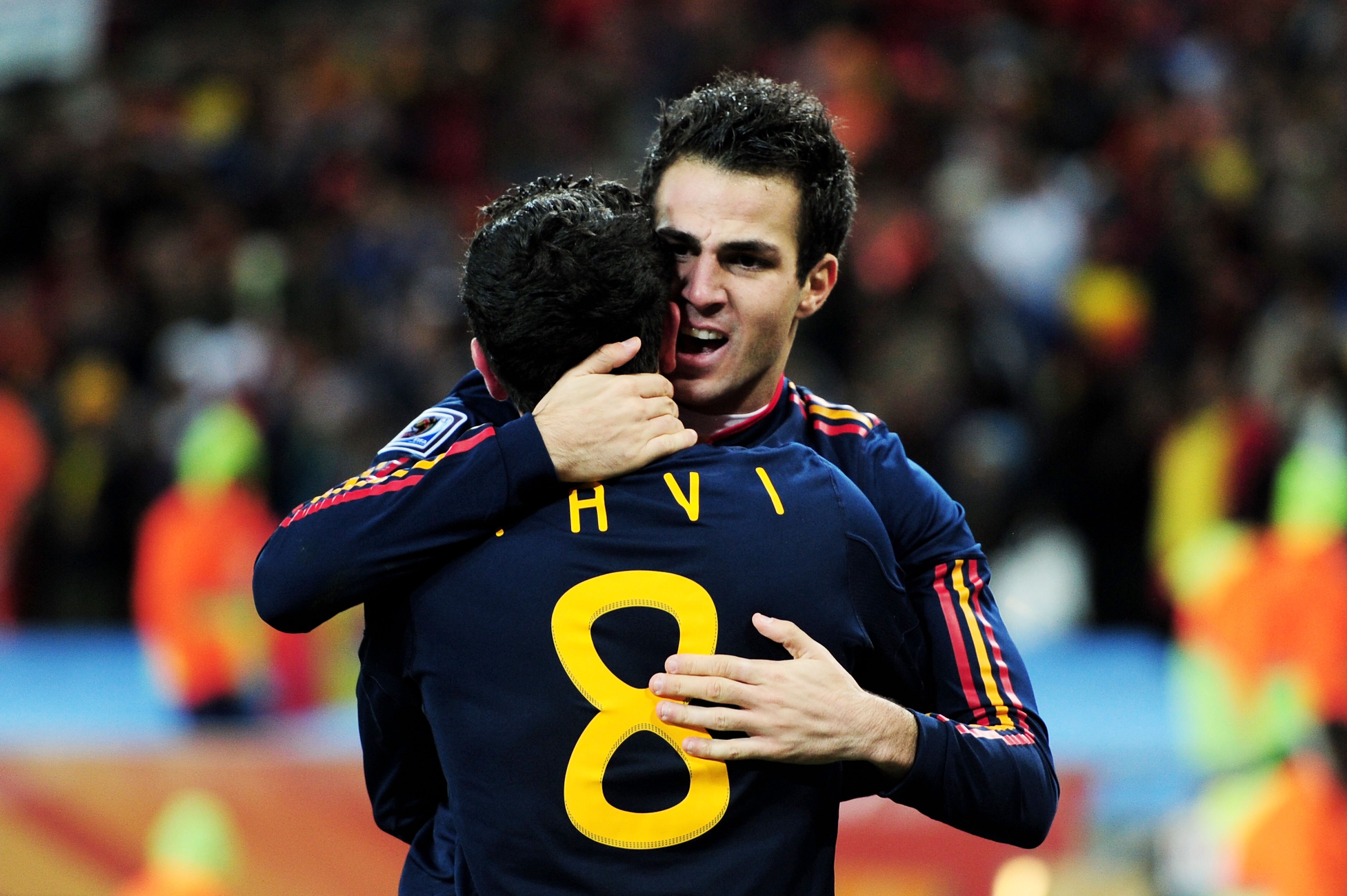 JOHANNESBURG, SOUTH AFRICA - JULY 11:  Xavi Hernandez and Francesc Fabregas of Spain celebrate winning the World Cup during the 2010 FIFA World Cup South Africa Final match between Netherlands and Spain at Soccer City Stadium on July 11, 2010 in Johannesb
