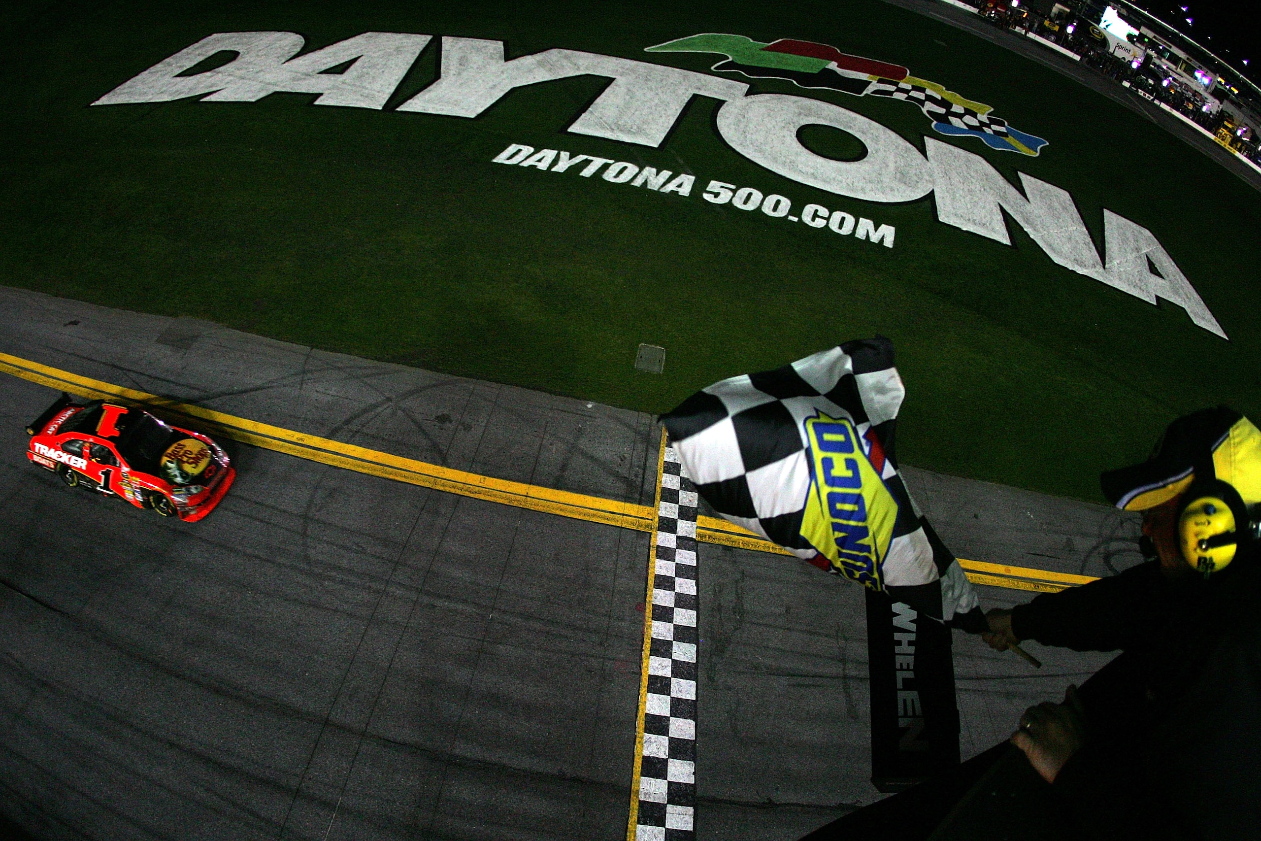 DAYTONA BEACH, FL - FEBRUARY 14:  Jamie McMurray, driver of the #1 Bass Pro Shops/Tracker Boats Chevrolet, approaches the finish line to win the NASCAR Sprint Cup Series Daytona 500 at Daytona International Speedway on February 14, 2010 in Daytona Beach,
