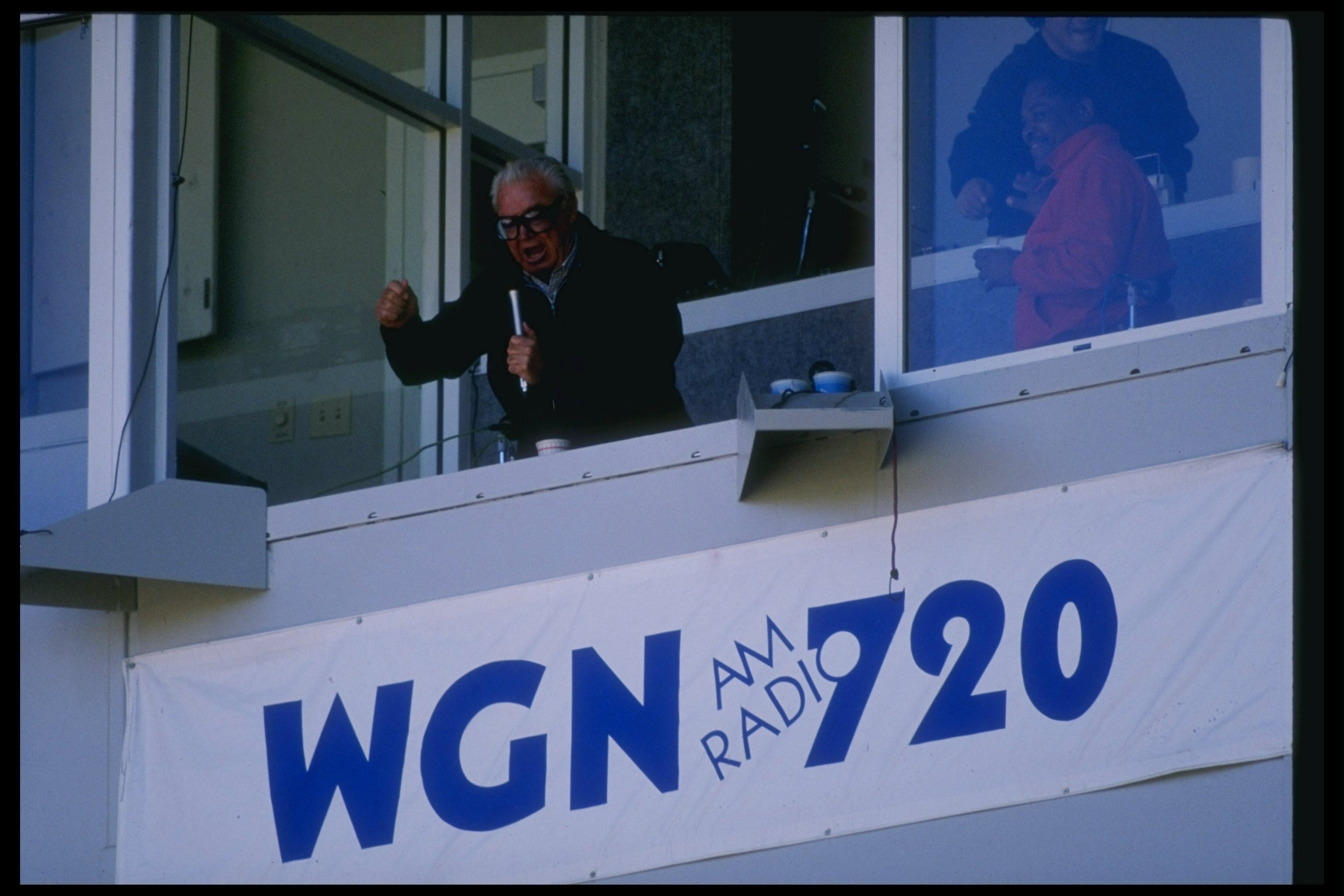 1989:  Sprotscaster Harry Carey sits in the broadcast booth at Wrigley Field in Chicago, Illinois. Mandatory Credit: Allsport  /Allsport