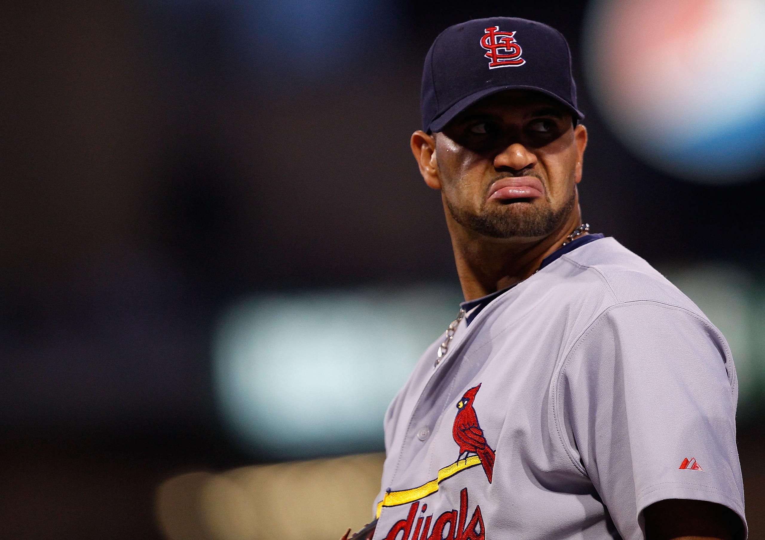 PITTSBURGH - AUGUST 25:  Albert Pujols #5 of the St. Louis Cardinals talks inbetween innings during the game against  the Pittsburgh Pirates on August 25, 2010 at PNC Park in Pittsburgh, Pennsylvania.  (Photo by Jared Wickerham/Getty Images)