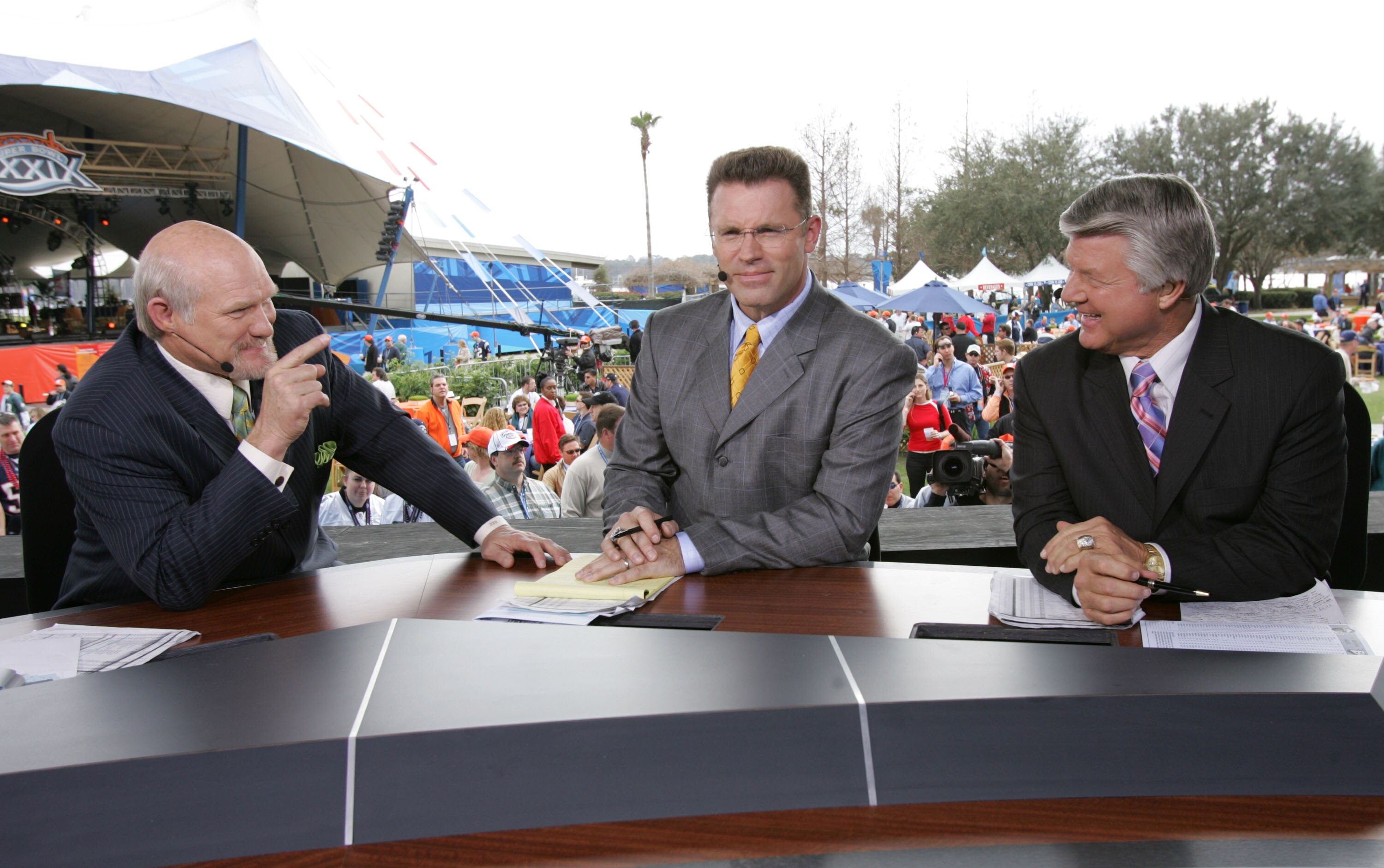 JACKSONVILLE, FL - FEBRUARY 06:  FOX sportscasters Terry Bradshaw, Howie Long and Jimmy Johnson speak in the FOX Braodcast booth during the XXXIX Superbowl pregame show at Alltel Stadium on February 6, 2005 in Jacksonville, Florida.  (Photo by Frank Micel